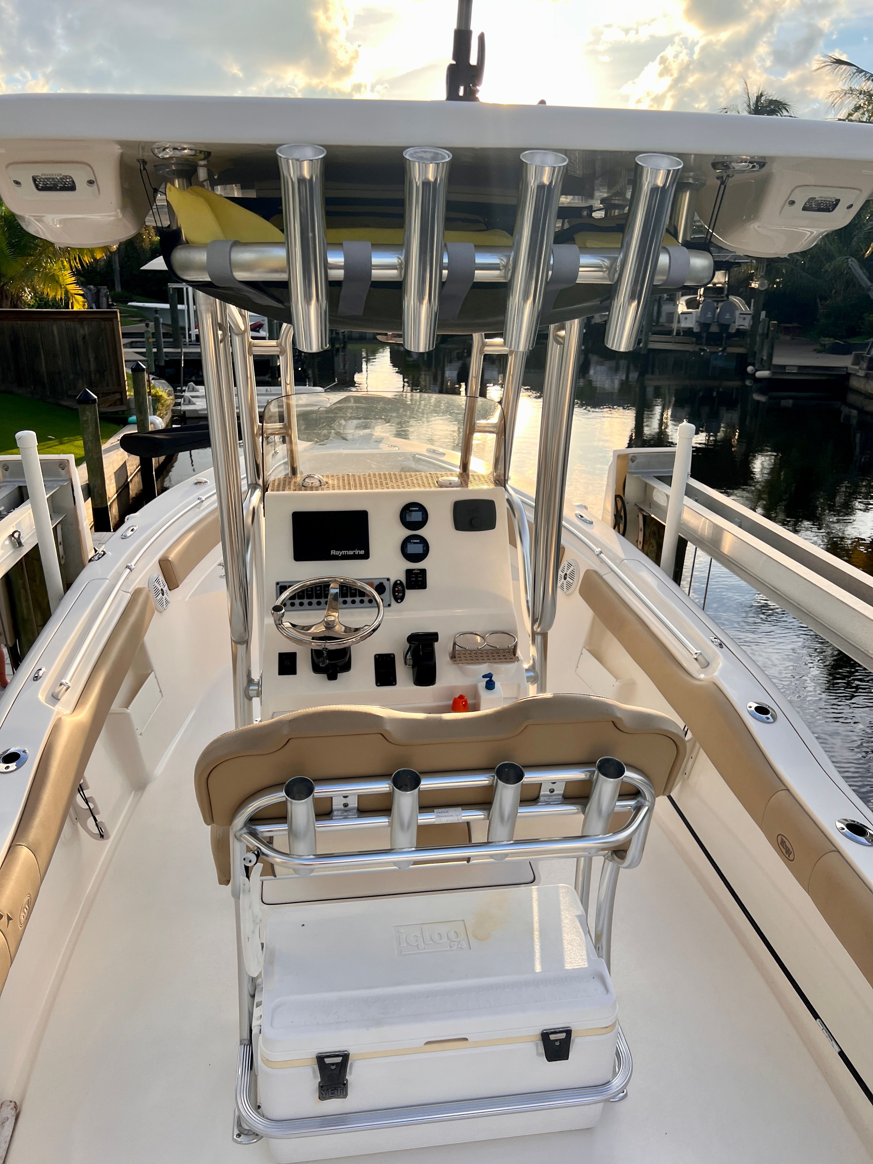 The image shows a 2018 Key West 239 FS boat with a helm station and fishing rod holders.