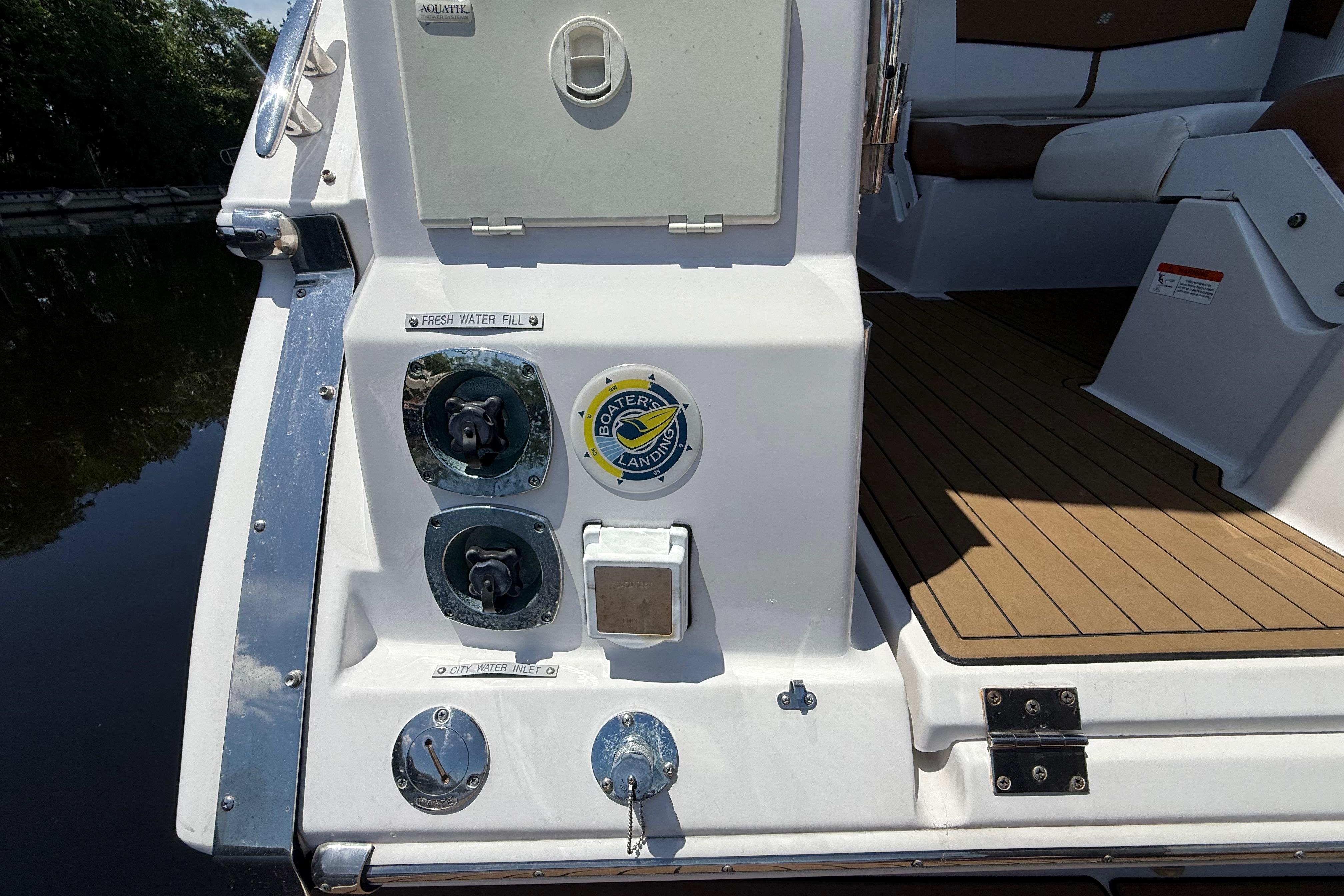 2017 Four Winns V275 boat deck with water inlet and fresh water fill.