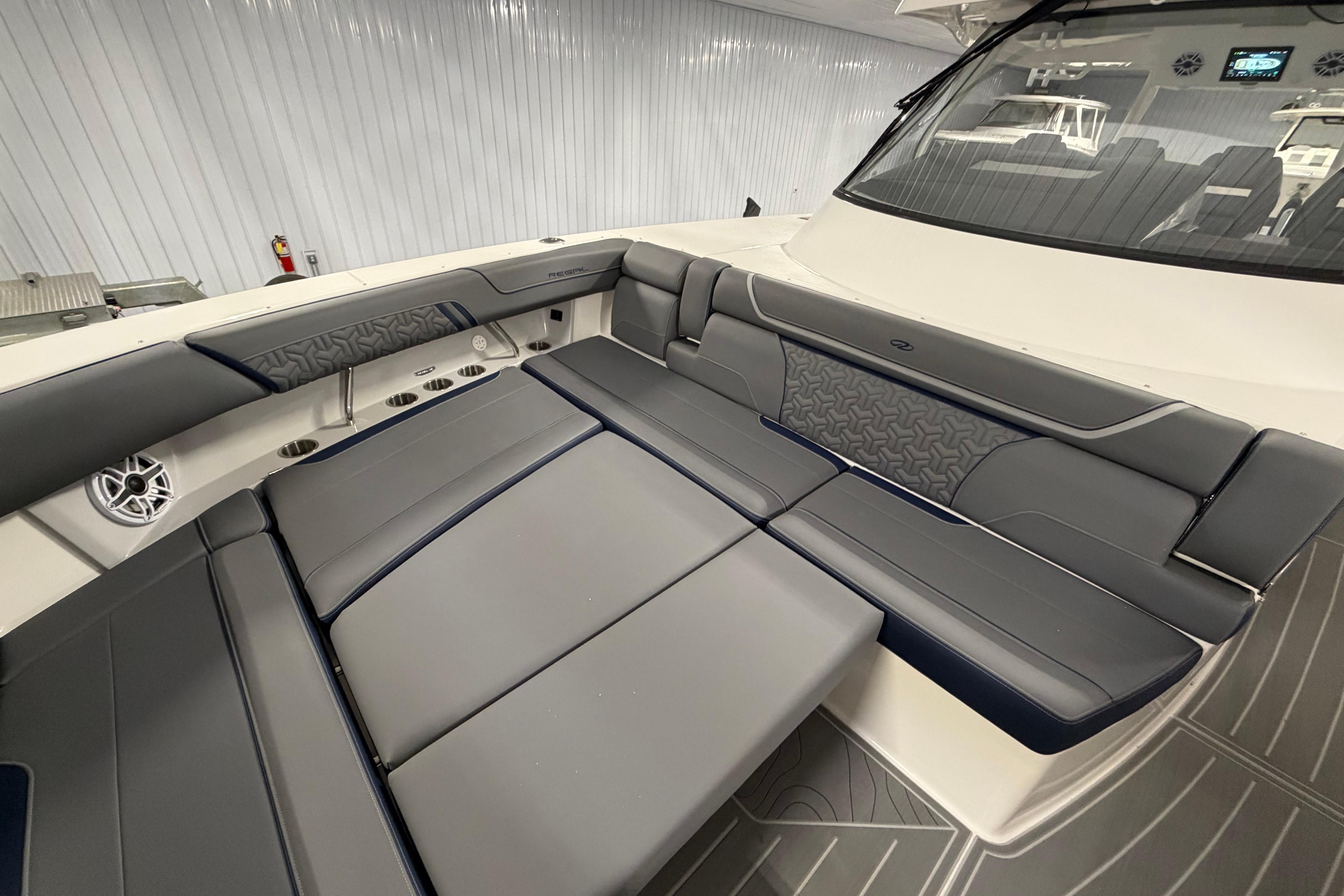 2027 Regal 38 Surf boat interior with luxurious gray seating and modern design.