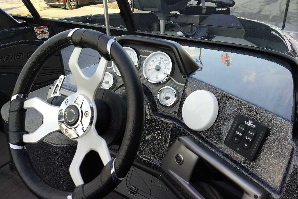 2024 Nitro ZV21 Pro boat dashboard with steering wheel and control panel.