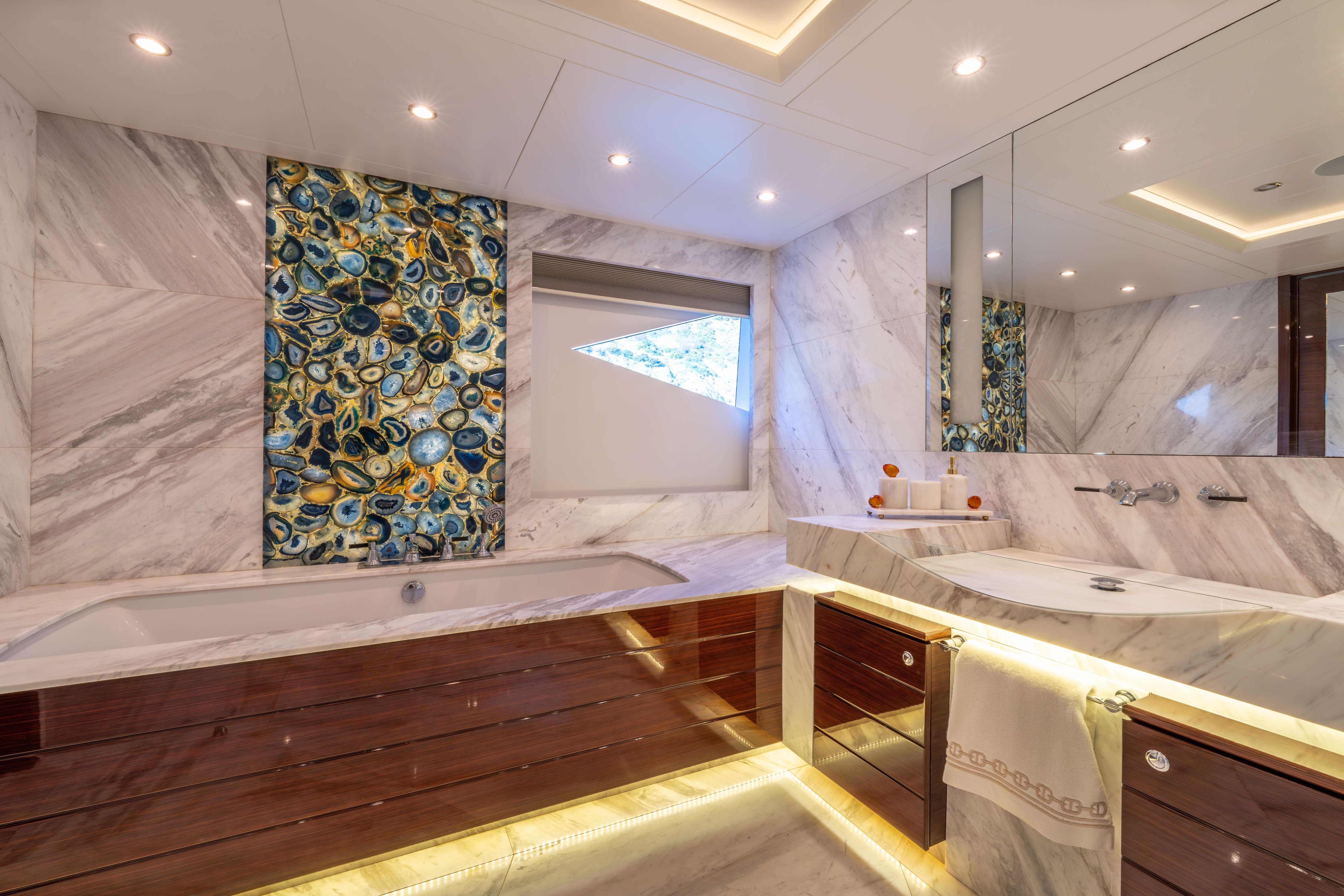 Luxurious Bilgin 147 yacht bathroom with marble decor and elegant lighting, 2014 model.