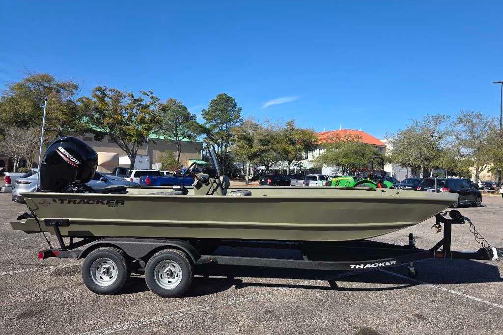 2026 Tracker Grizzly 2072 CC boat on trailer in parking lot.