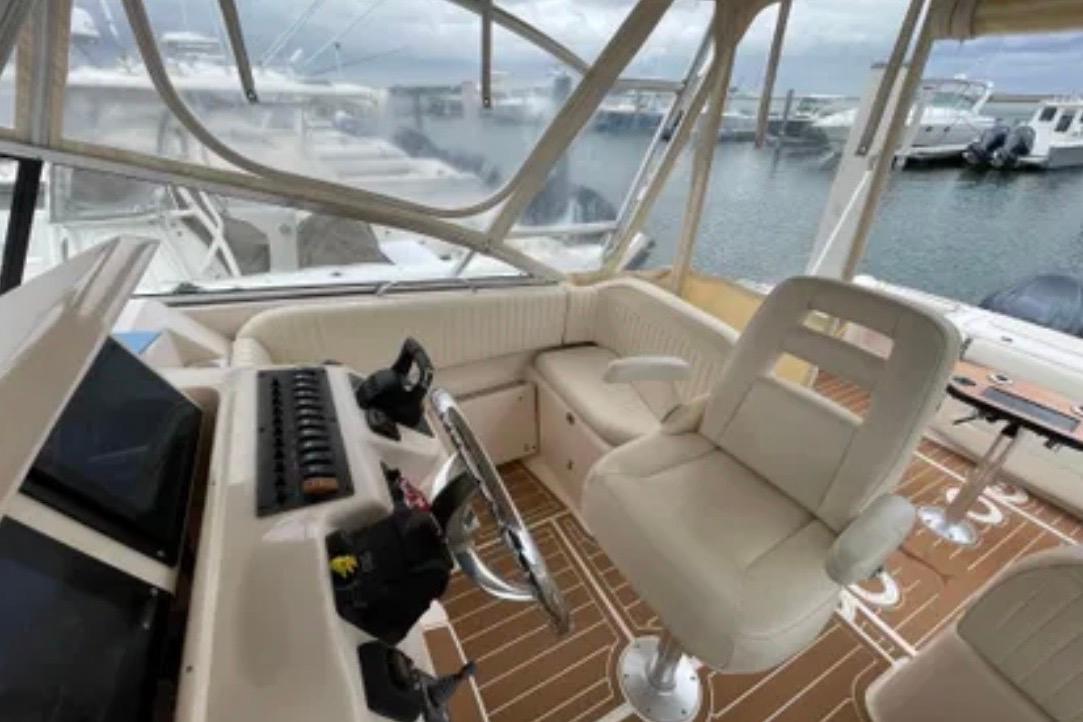 Interior of a 2007 Grady-White Express 330 boat with helm and seating area.