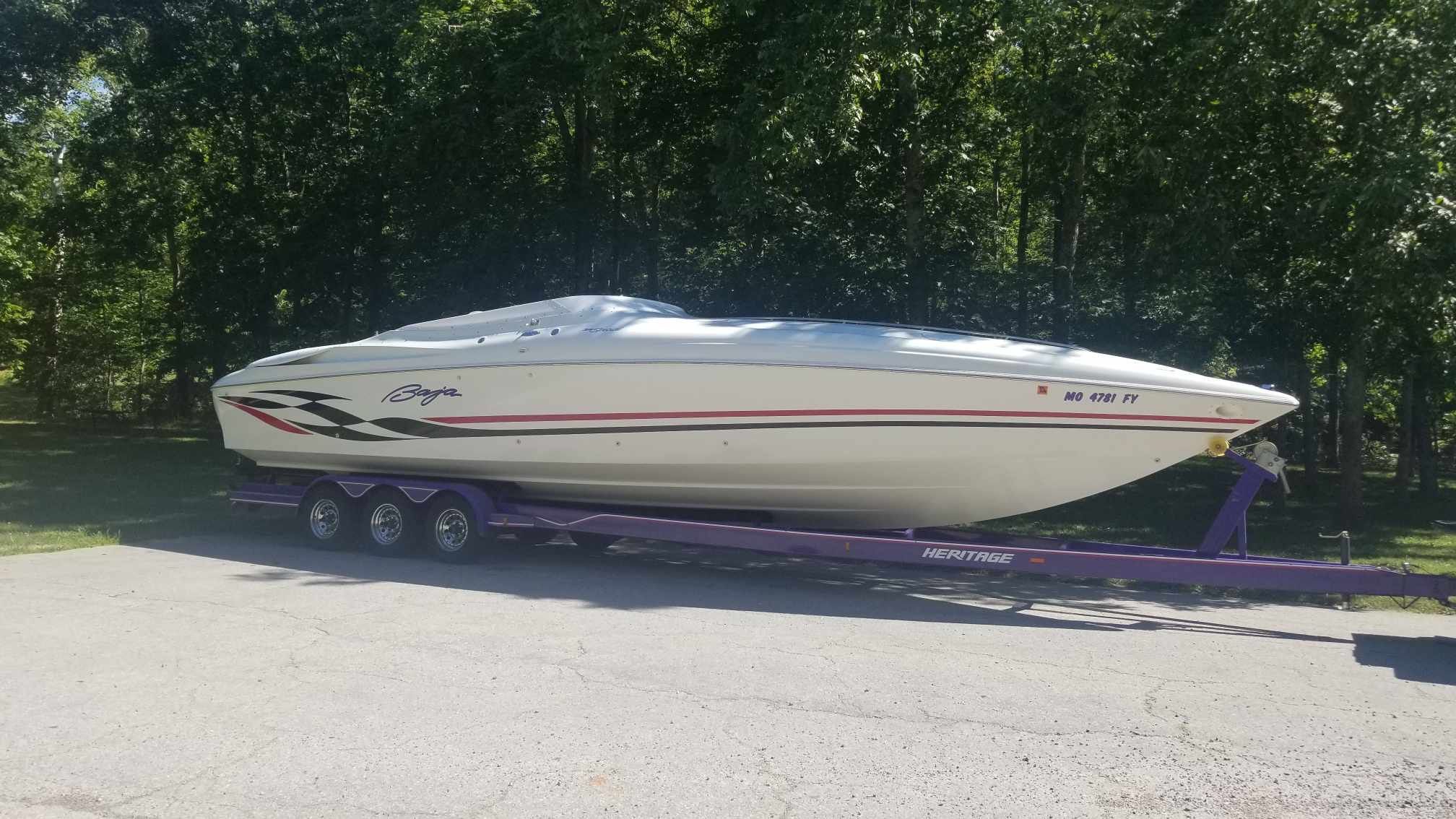 1997 Baja 38 Special Boss parked on trailer outdoors.