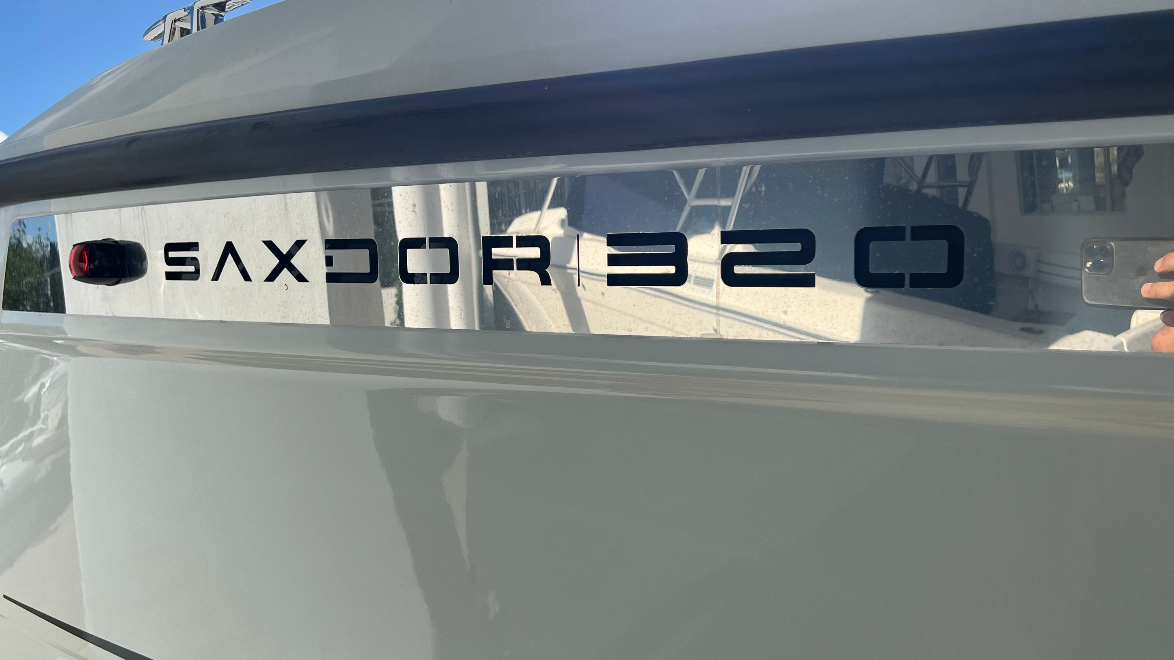 Close-up of Saxdor 320 GTO lettering on a boat.