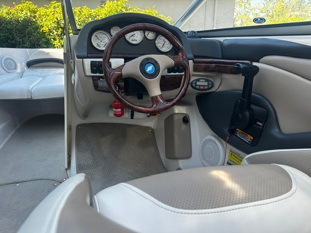 Interior view of a 2006 Four Winns 190 Horizon with steering wheel and dashboard.