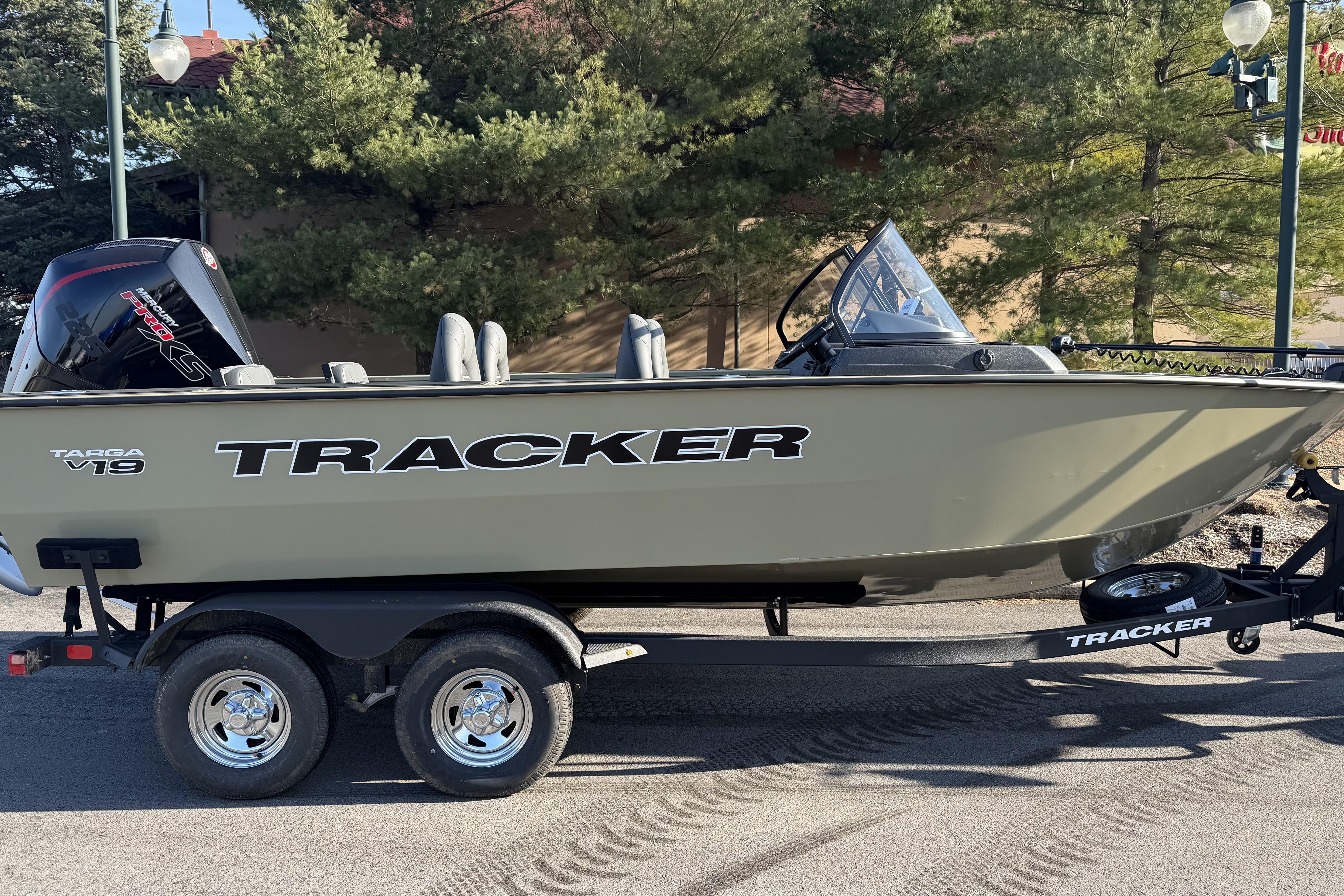 2026 Tracker Targa V-19 Combo boat on trailer, parked outdoors.