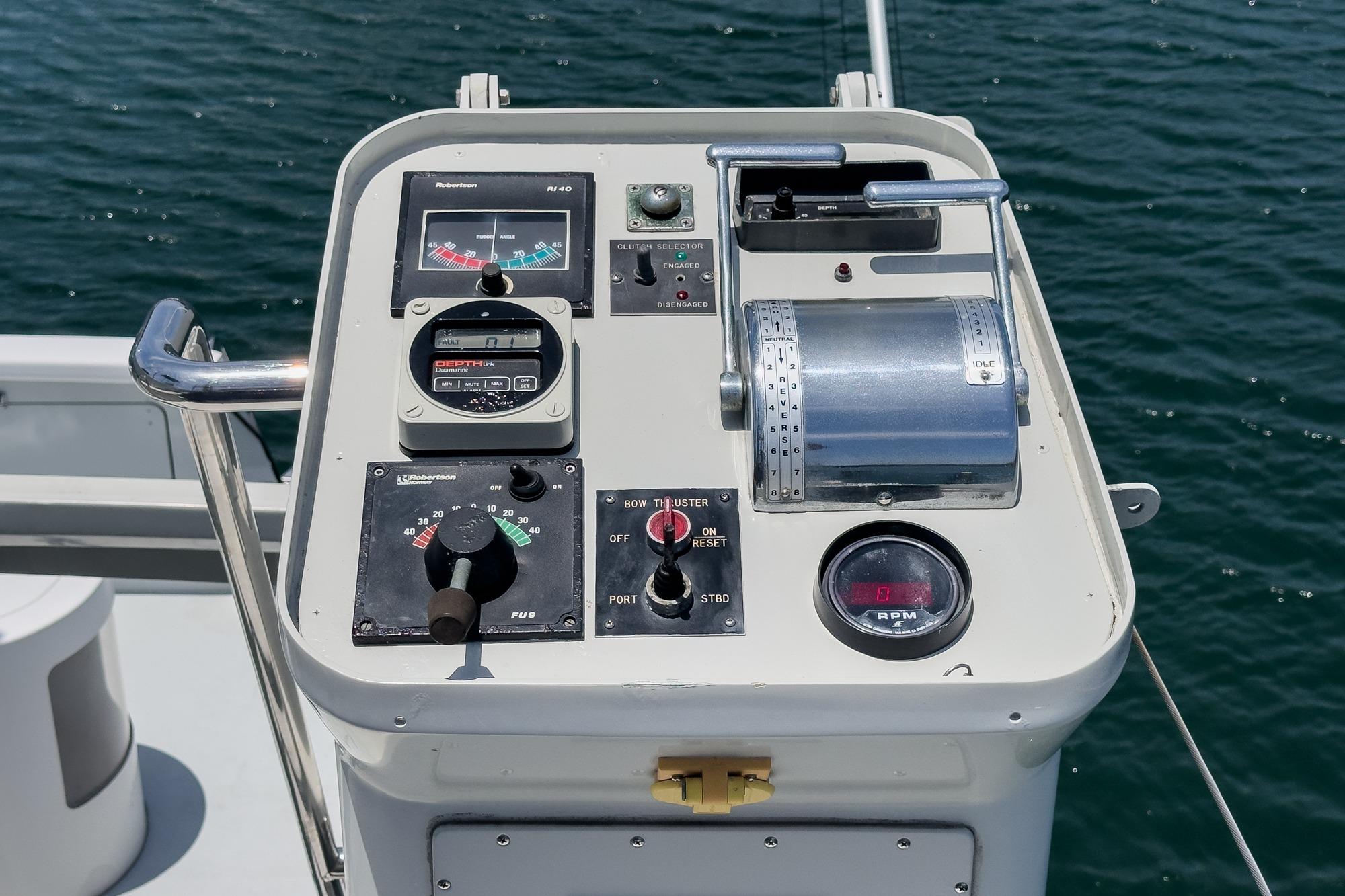 Control panel of a 1990 Seaton Long Range Cruiser on open water.