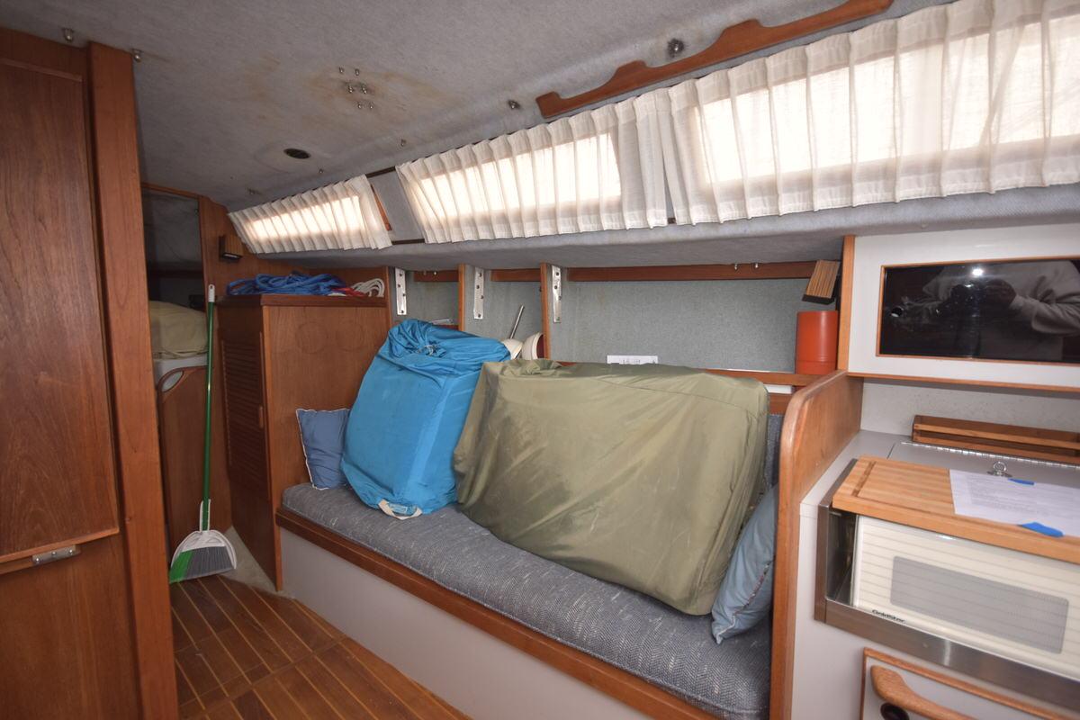 Interior of a 1987 S2 9.2A with wood flooring and curtains.