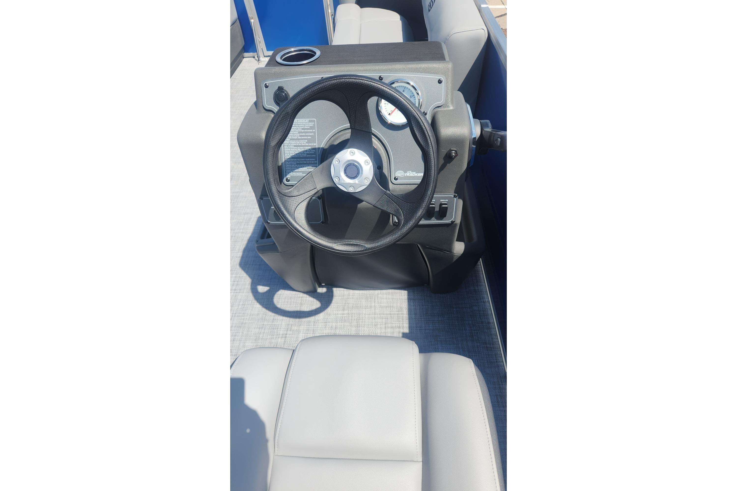 Steering console of 2026 Sun Tracker Party Barge 16 DLX pontoon boat.