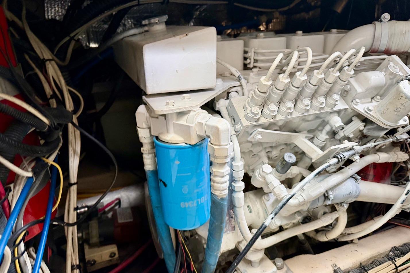 Engine compartment of a 2003 Tiara Yachts 3500 Open, showcasing mechanical components and wiring.