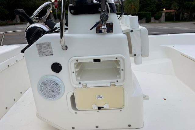 2016 Boston Whaler 150 Montauk boat console with storage compartment and steering wheel.