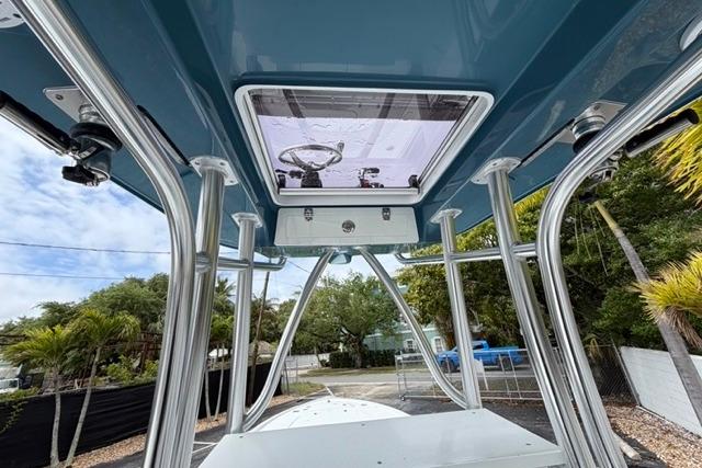 2025 Contender 26 Bay boat with sleek design and sturdy metal framework.