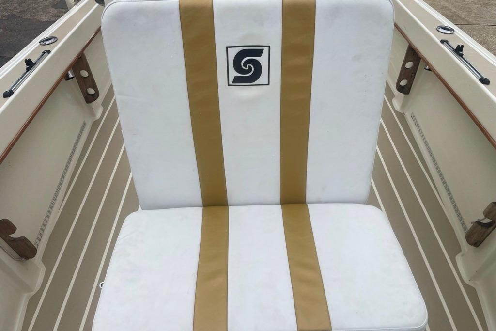 White and gold boat seat on 1983 Sea Craft SF18 vessel.