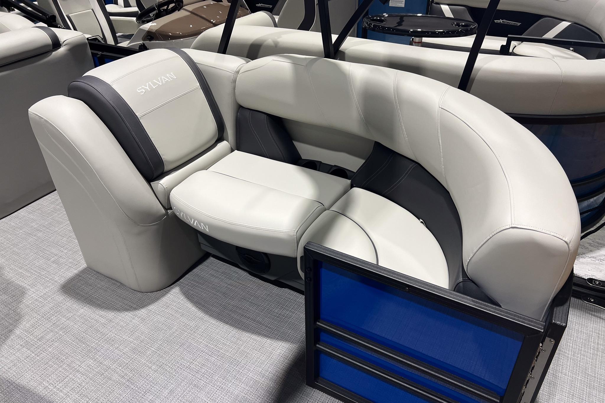 2026 Sylvan Mirage 822 CLZ boat interior with luxurious white seating and modern design.