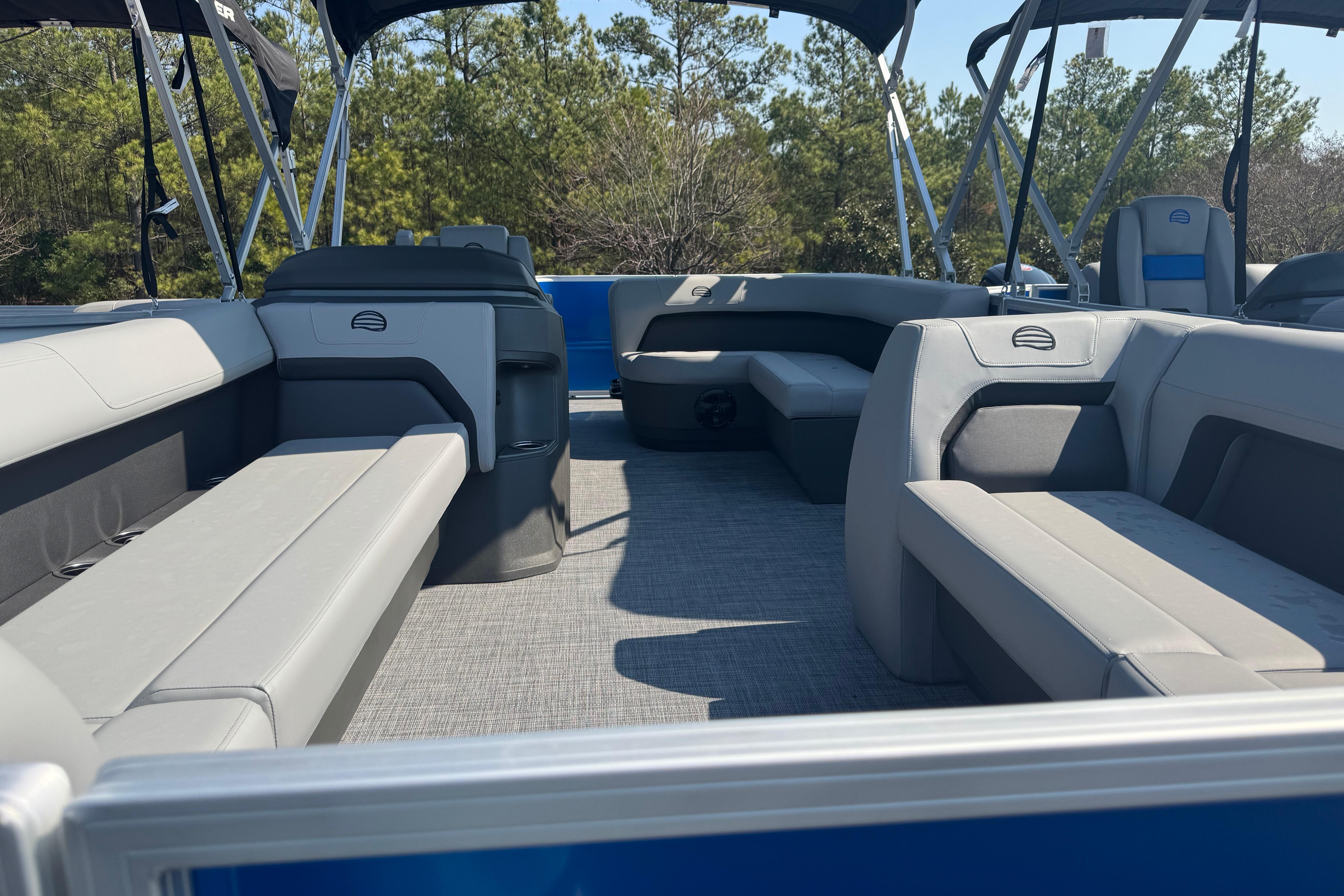 2026 Sun Tracker Party Barge 18 DLX interior with spacious seating and canopy.
