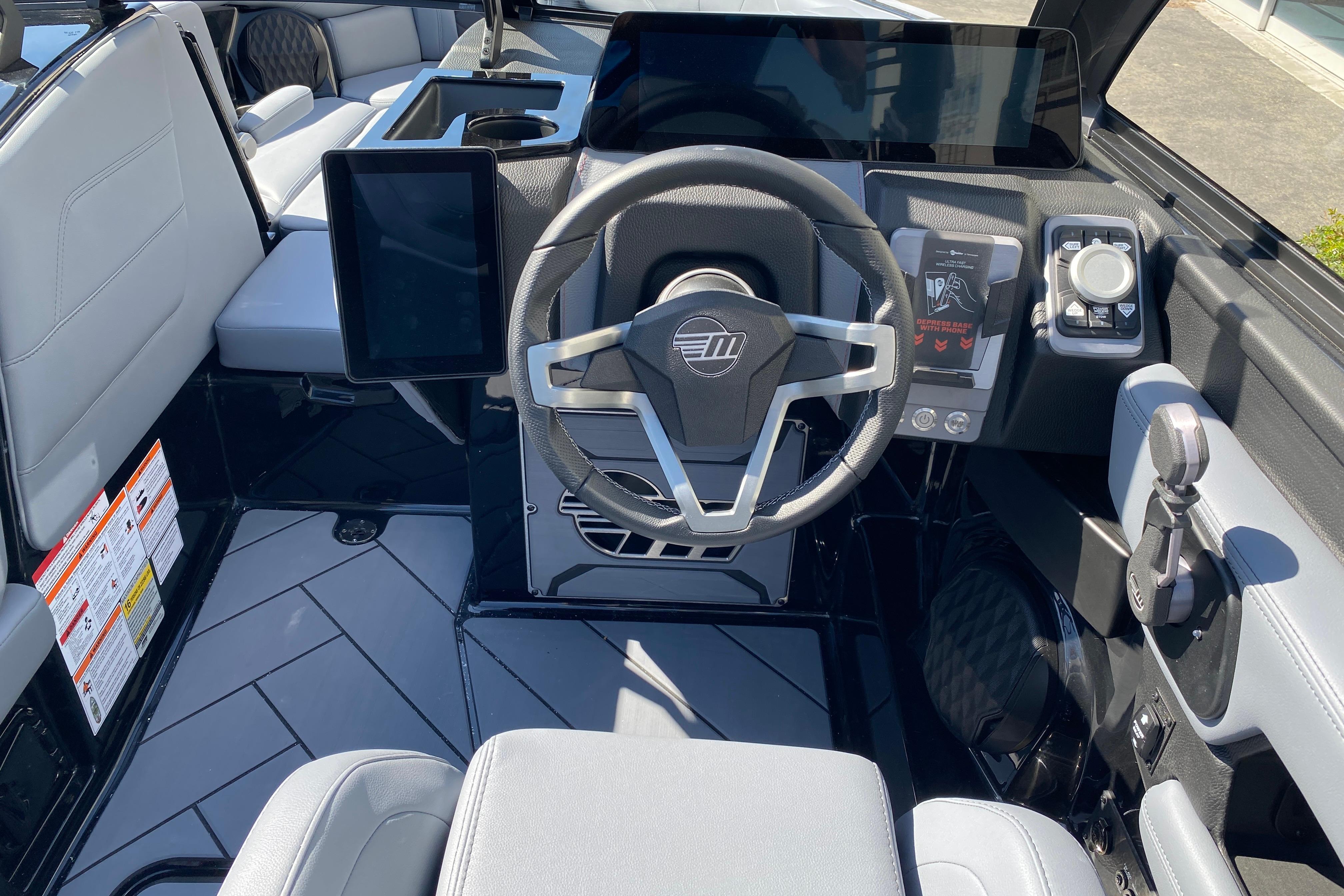 2025 Malibu Wakesetter 23 LSV cockpit with modern steering and digital controls.