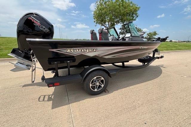 2026 Ranger VS1782SC Angler boat on trailer, parked outdoors under blue sky.