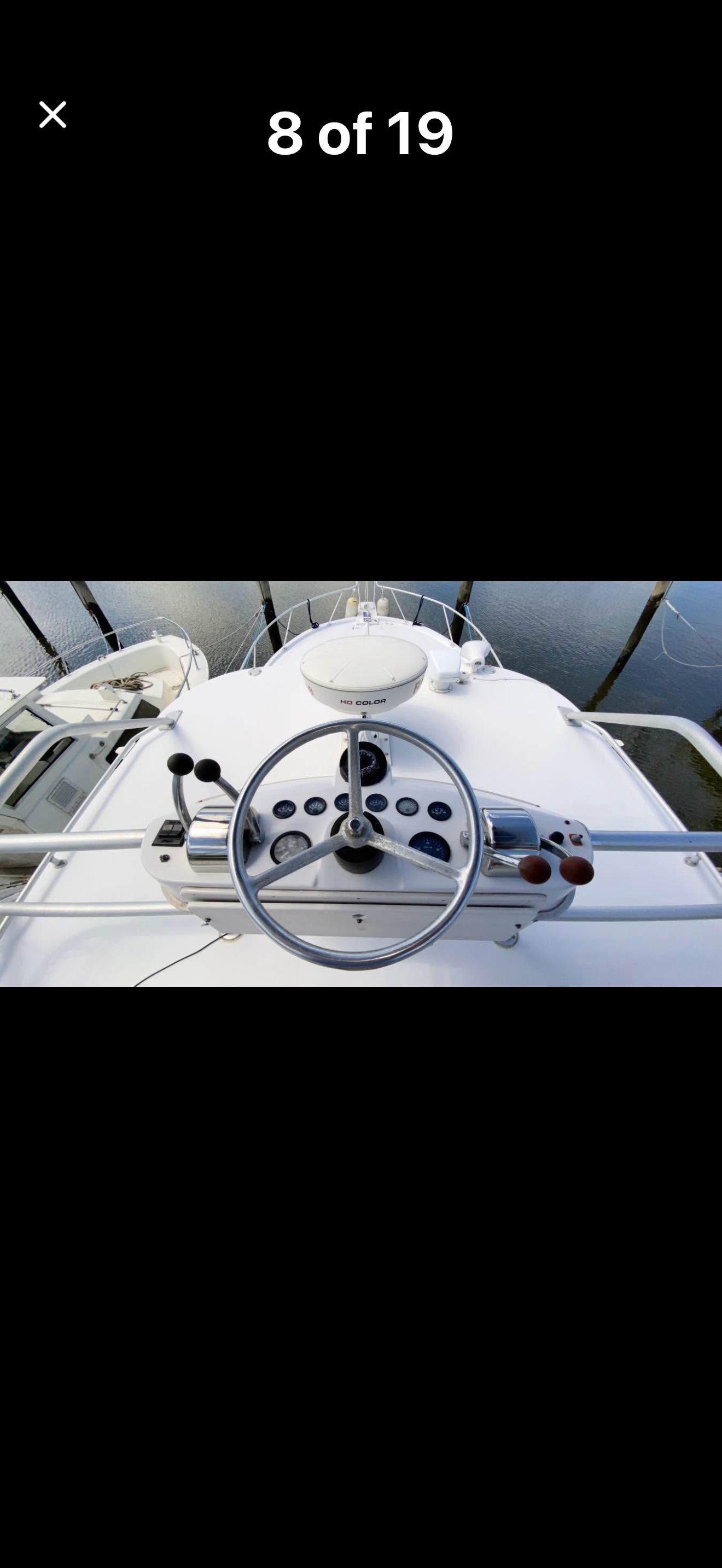 The image shows the helm of a 1999 Luhrs Sx36 with various instruments.