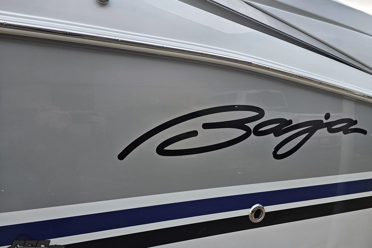 2008 Baja 335 Performance boat with sleek logo and blue stripe detail.