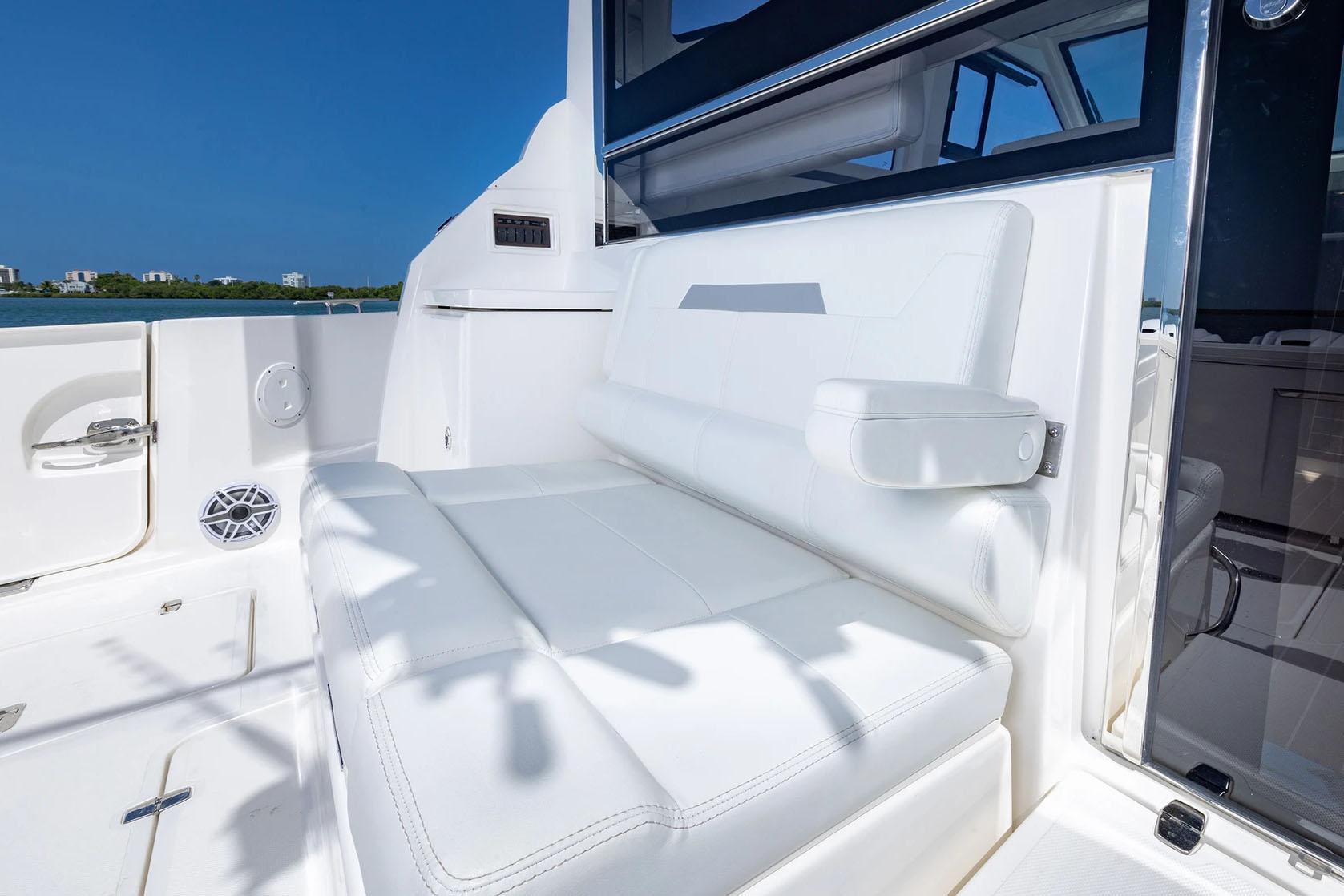 Manufacturer Provided Image: 2025 Pursuit OS 445 Offshore boat interior with white seating and armrest.