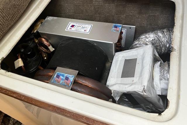 1979 Pearson 365 Ketch boat compartment with HVAC components and ductwork.