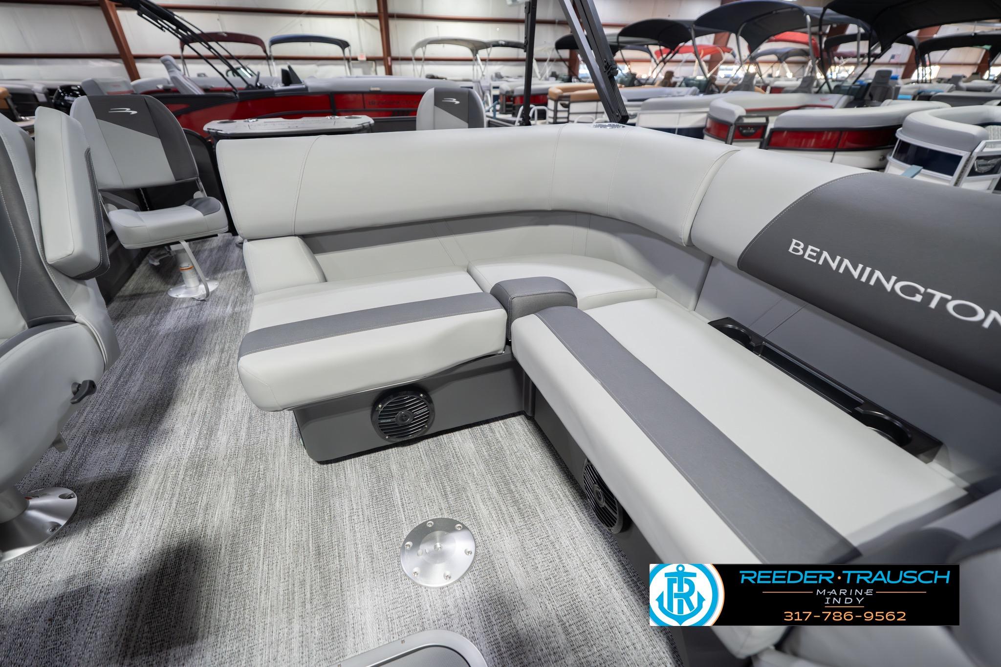 2026 Bennington 22 SF boat interior with gray seating and carpeted flooring.