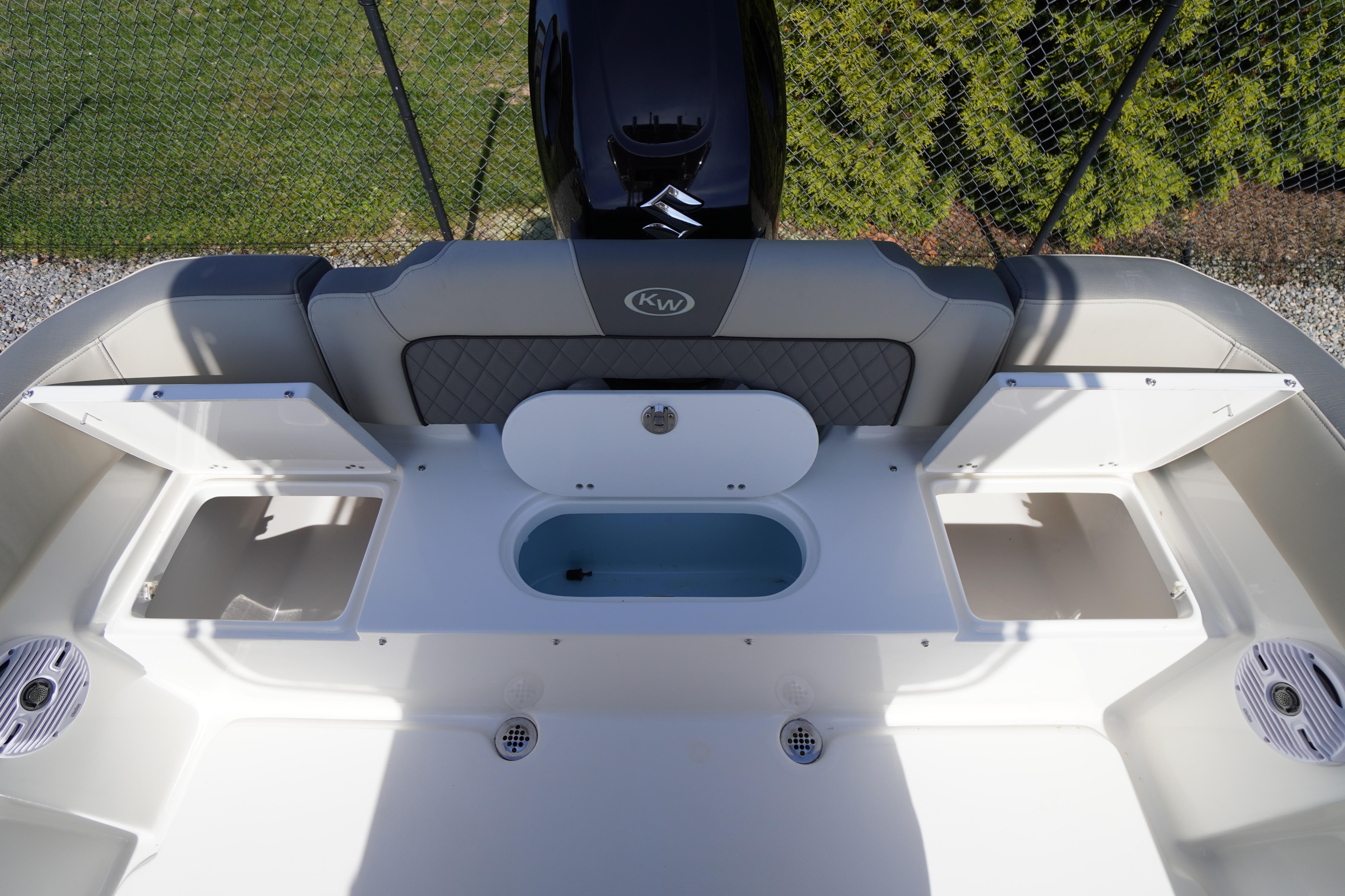 2025 Key West 203 FS boat interior with storage compartments and seating.