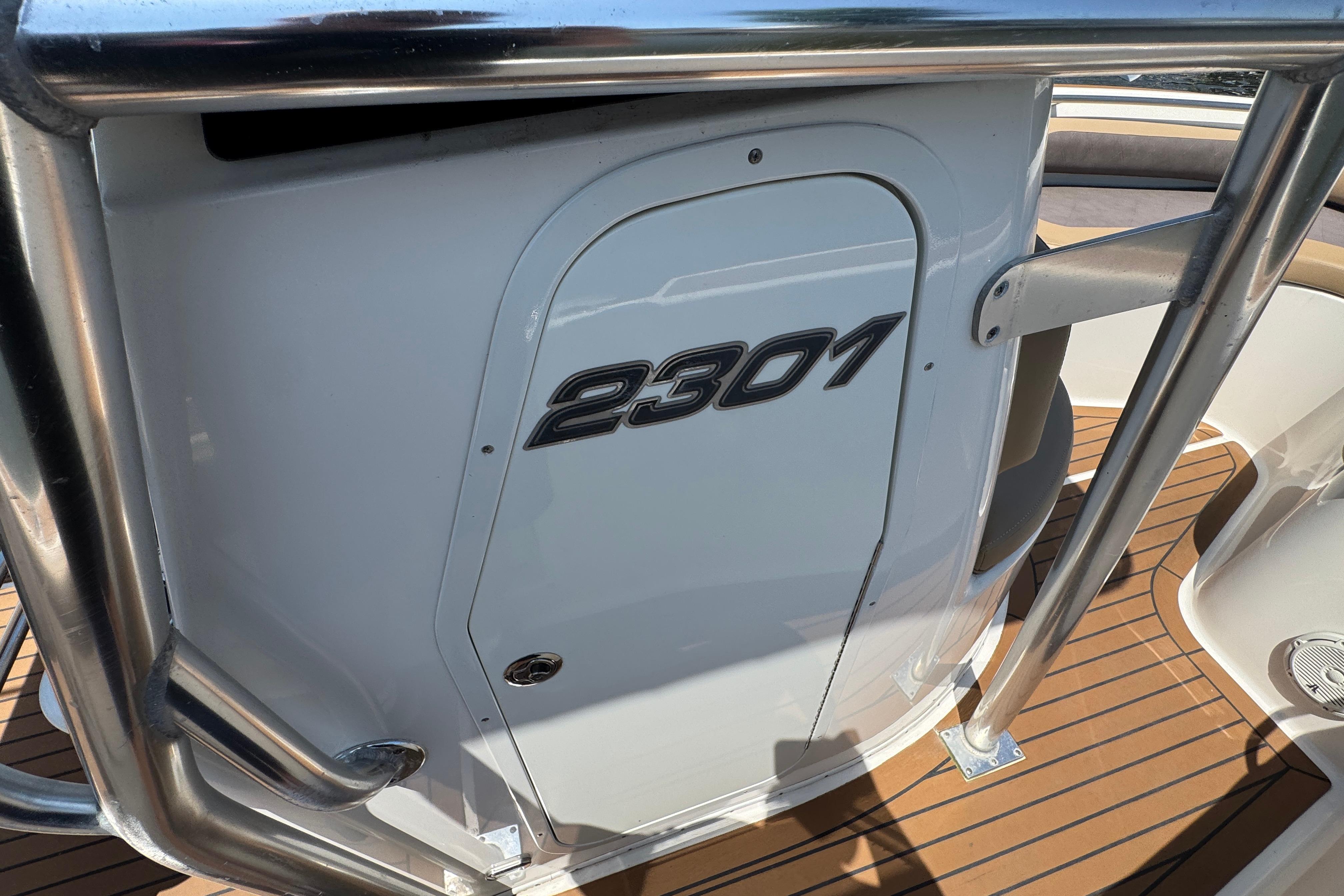 2014 Century 2301 Center Console boat with sleek design and stainless steel railing.