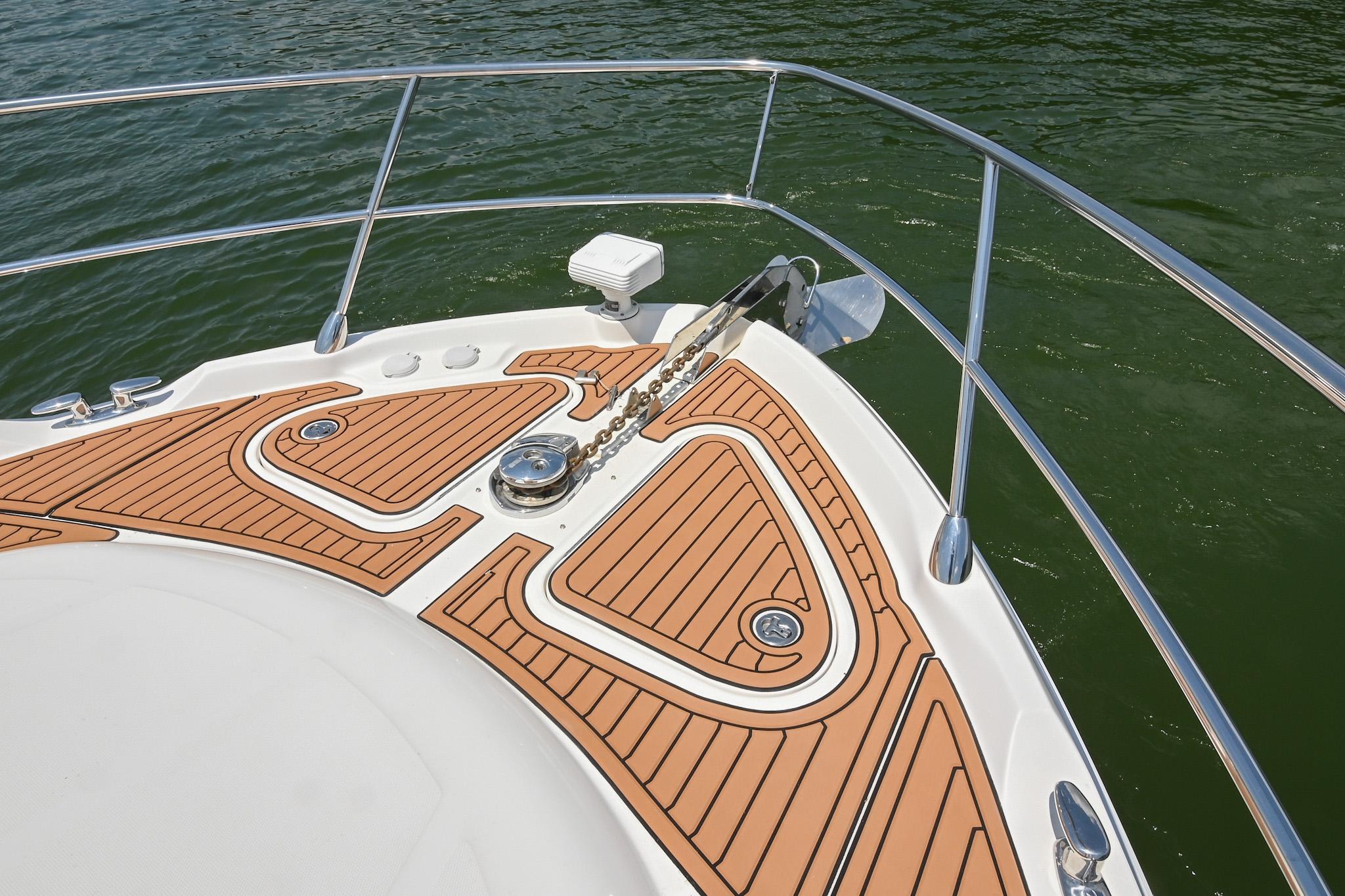 Bow of 2007 Sea Ray 60 Sundancer with teak decking and anchor chain.