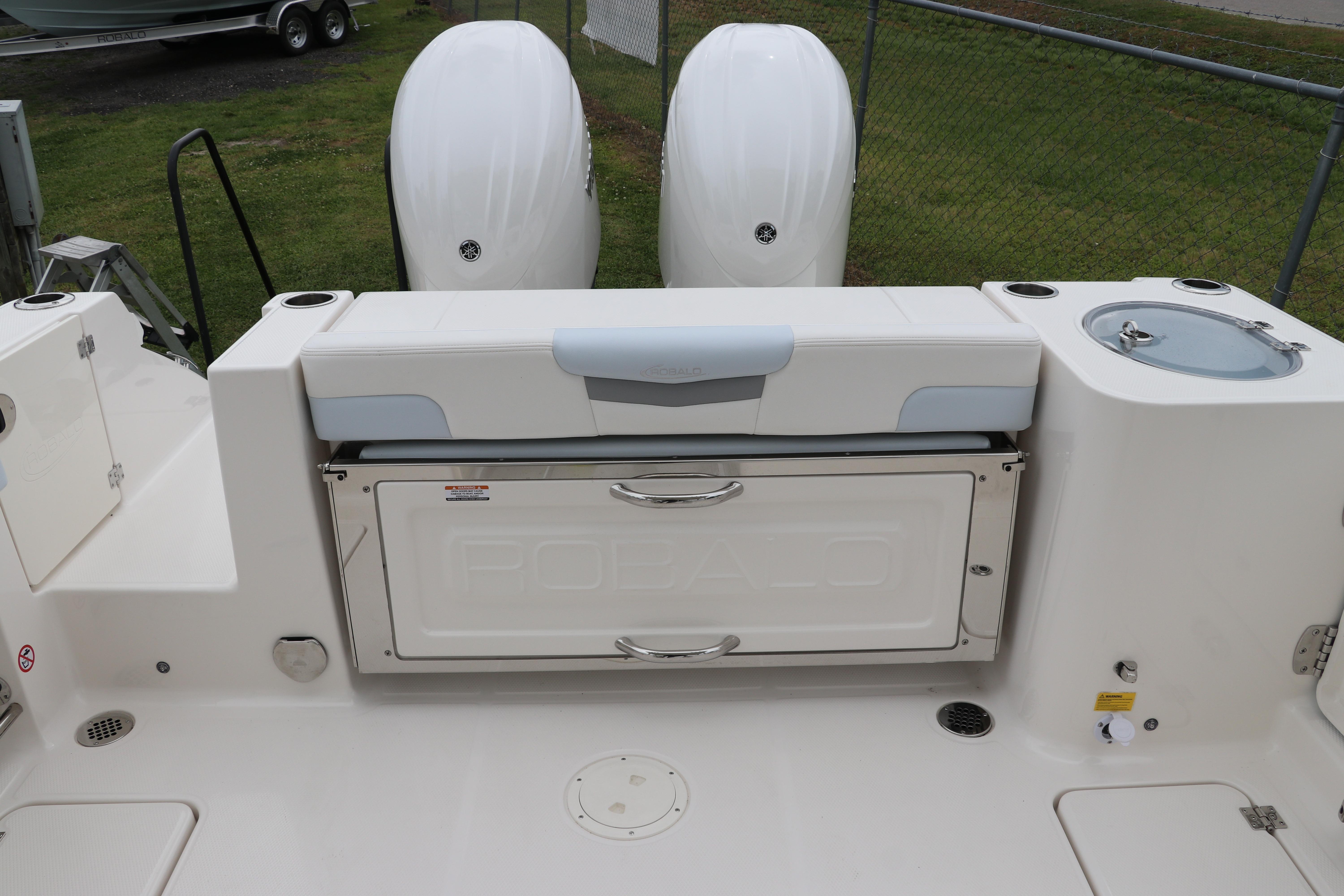 2026 Robalo R257 Dual Console boat interior with dual engines and seating area.