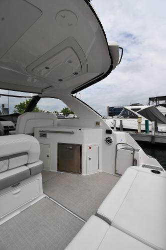 2021 Regal 35 Sport Coupe interior, featuring sleek seating and modern amenities at a marina.