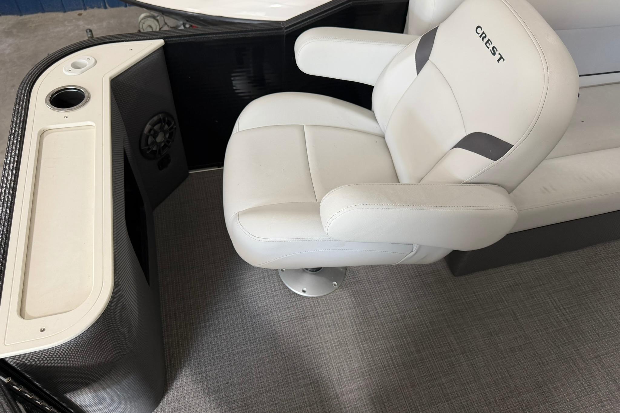 2023 Crest Classic LX 200 boat interior with white captain's chair and console.