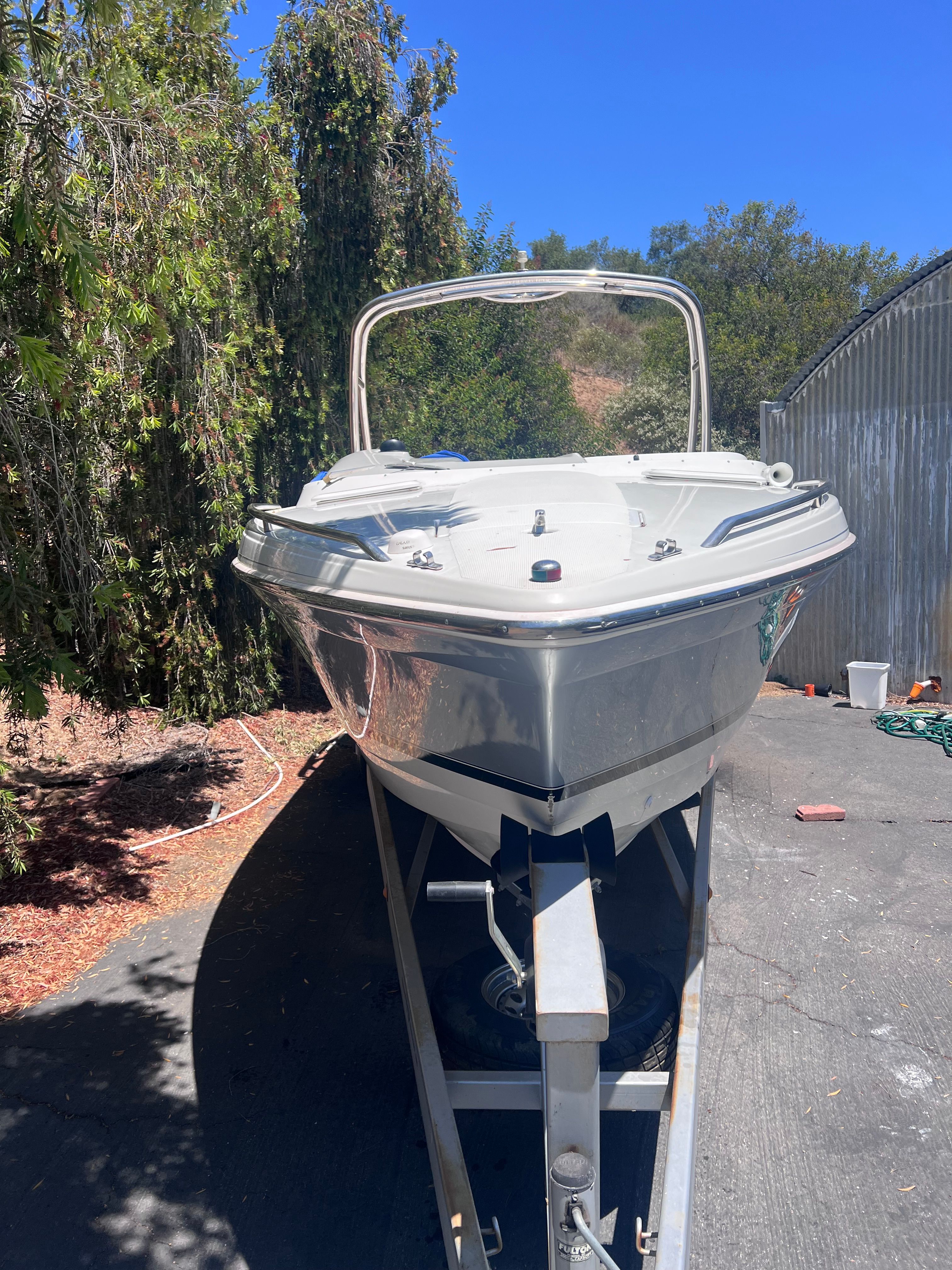 2006 Formula 260 Sun Sport boat on trailer outdoors.