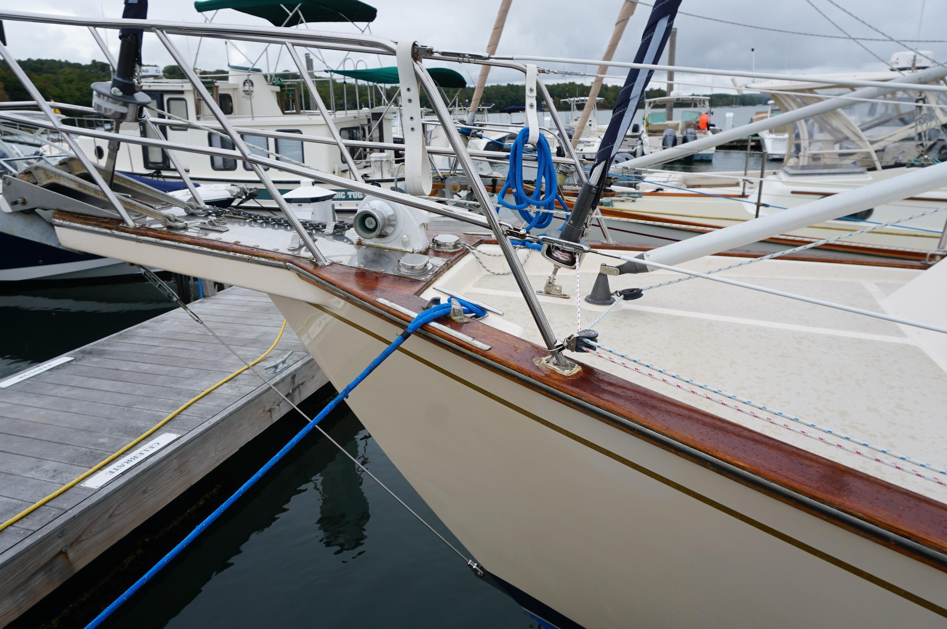 1994 Island Packet 32 sailboat docked at marina, featuring detailed bow and deck.