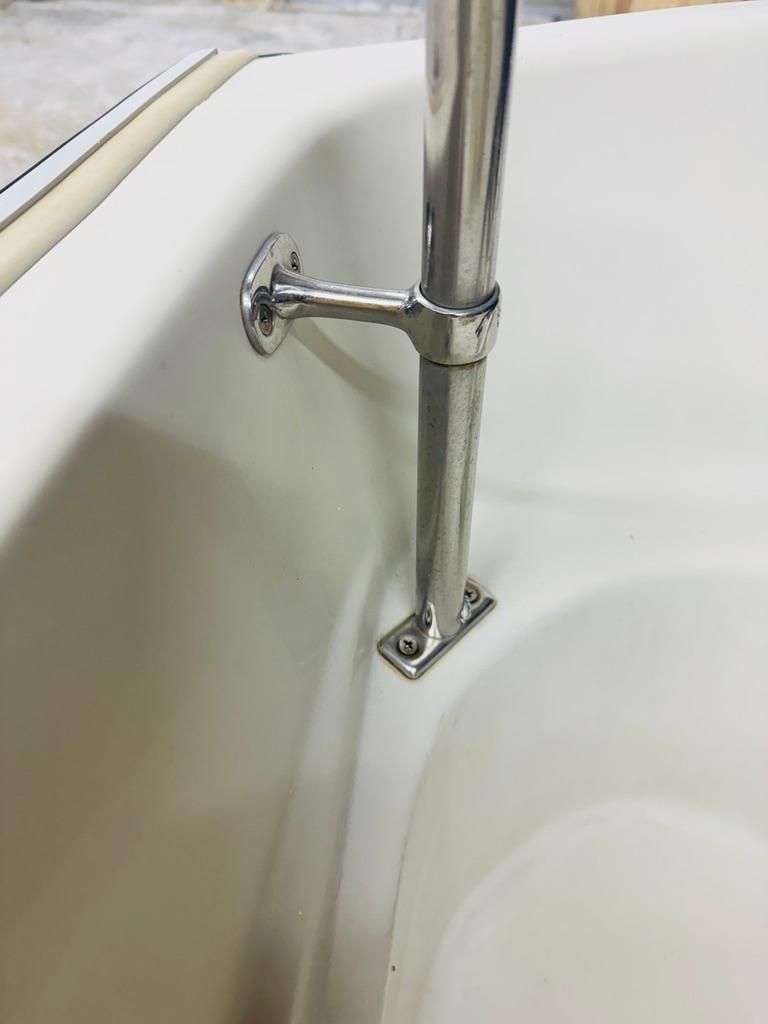 Close-up of a stainless steel handrail on a boat.
