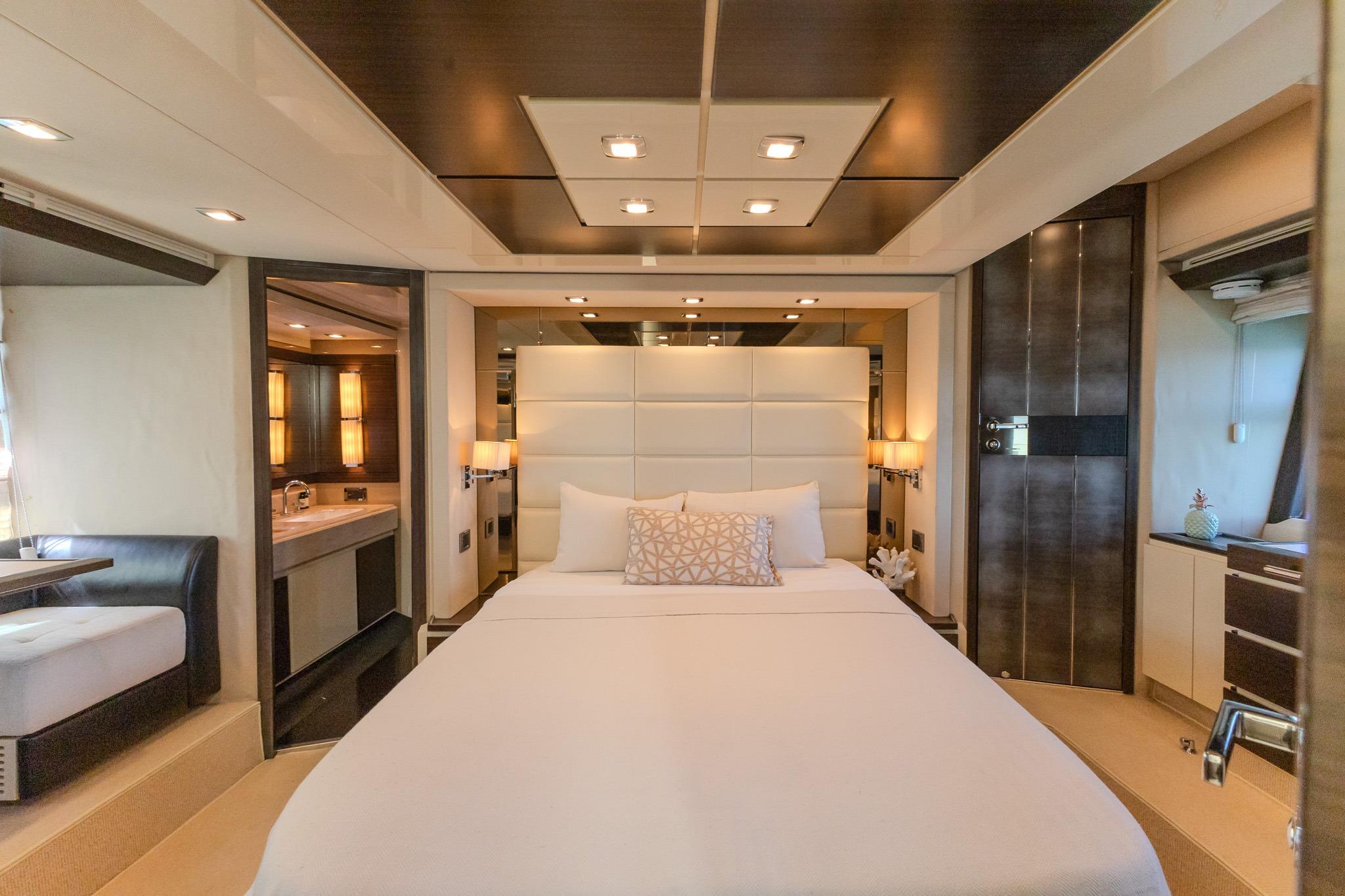 Luxurious bedroom interior of 2013 Azimut Fly 72 yacht, featuring elegant design and modern amenities.