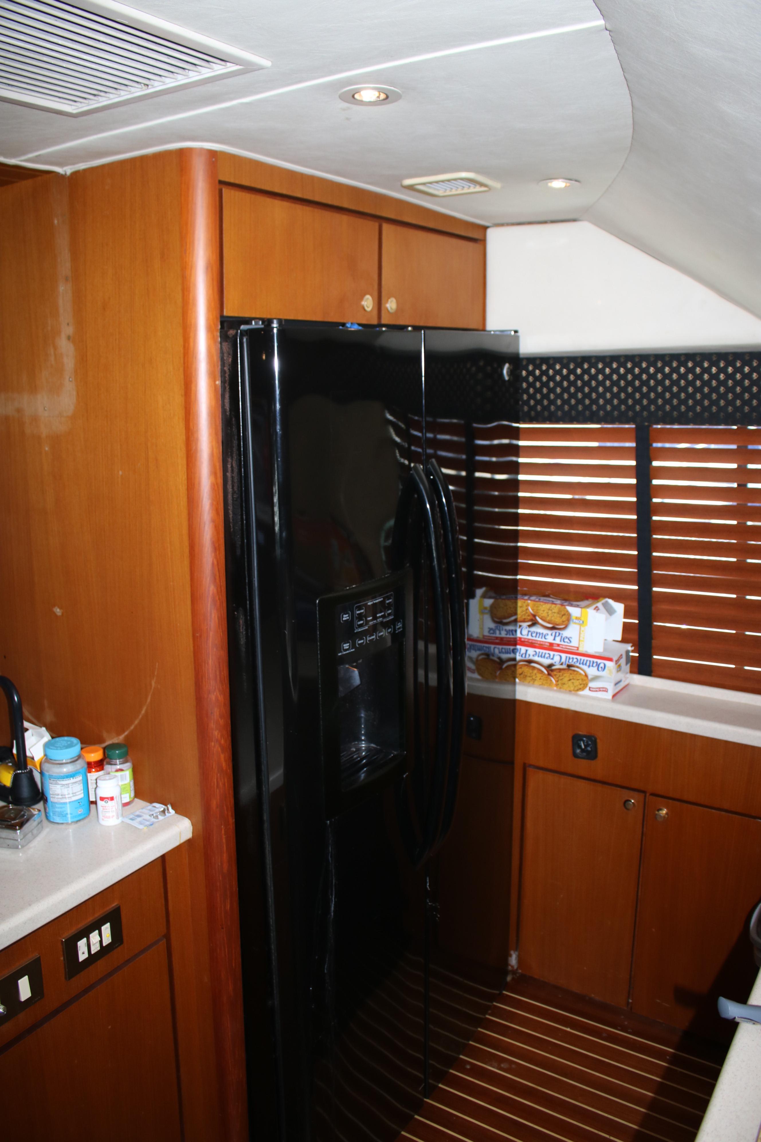 Interior of a 1999 Ocean Yachts model, featuring a sleek kitchen area.