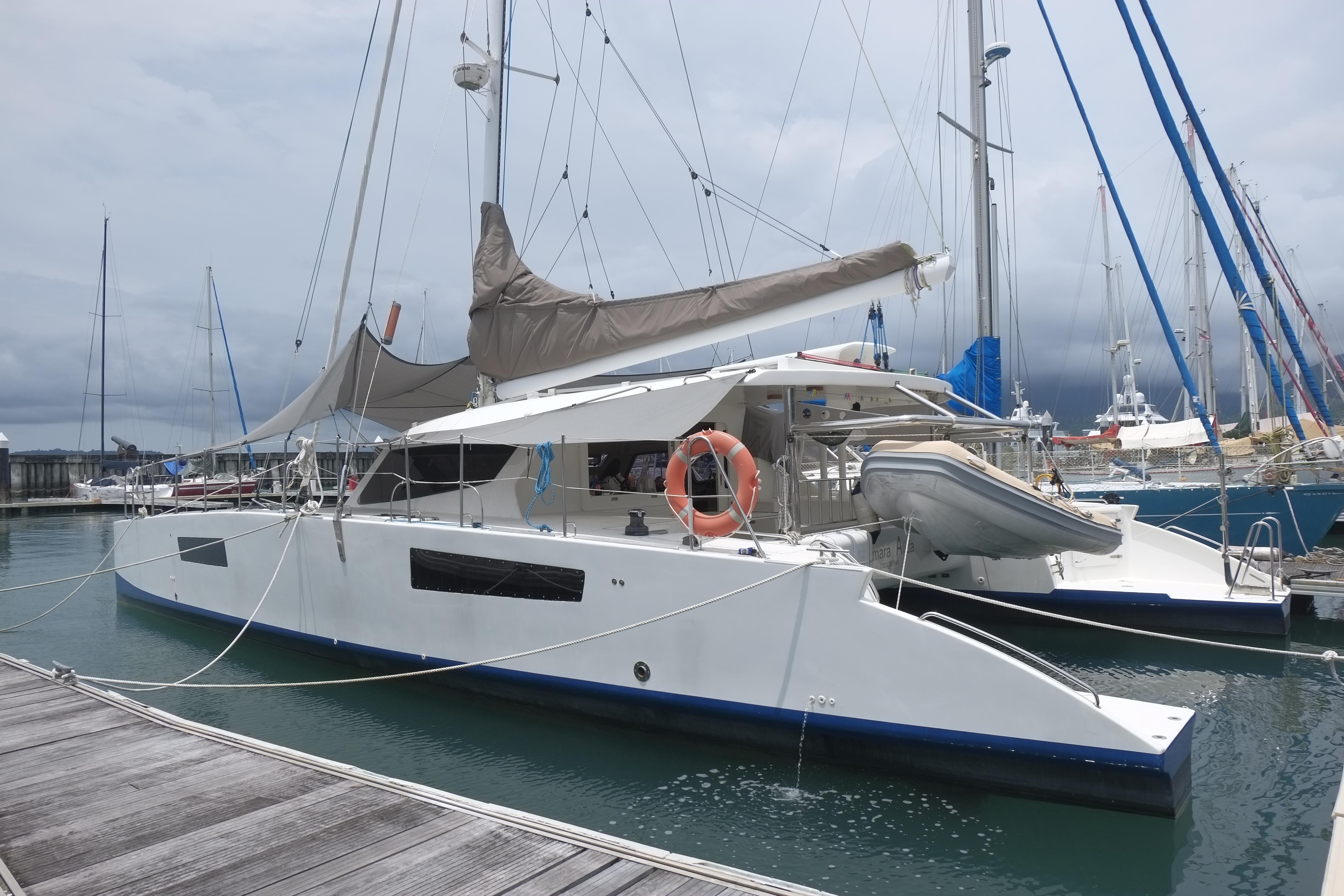 2015 Catamaran Catathai 50 docked at marina, featuring sleek design and modern amenities.