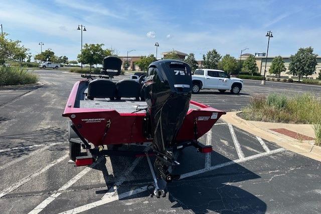 2026 Tracker Pro Team 175 Crappie Edition boat in parking lot, rear view.