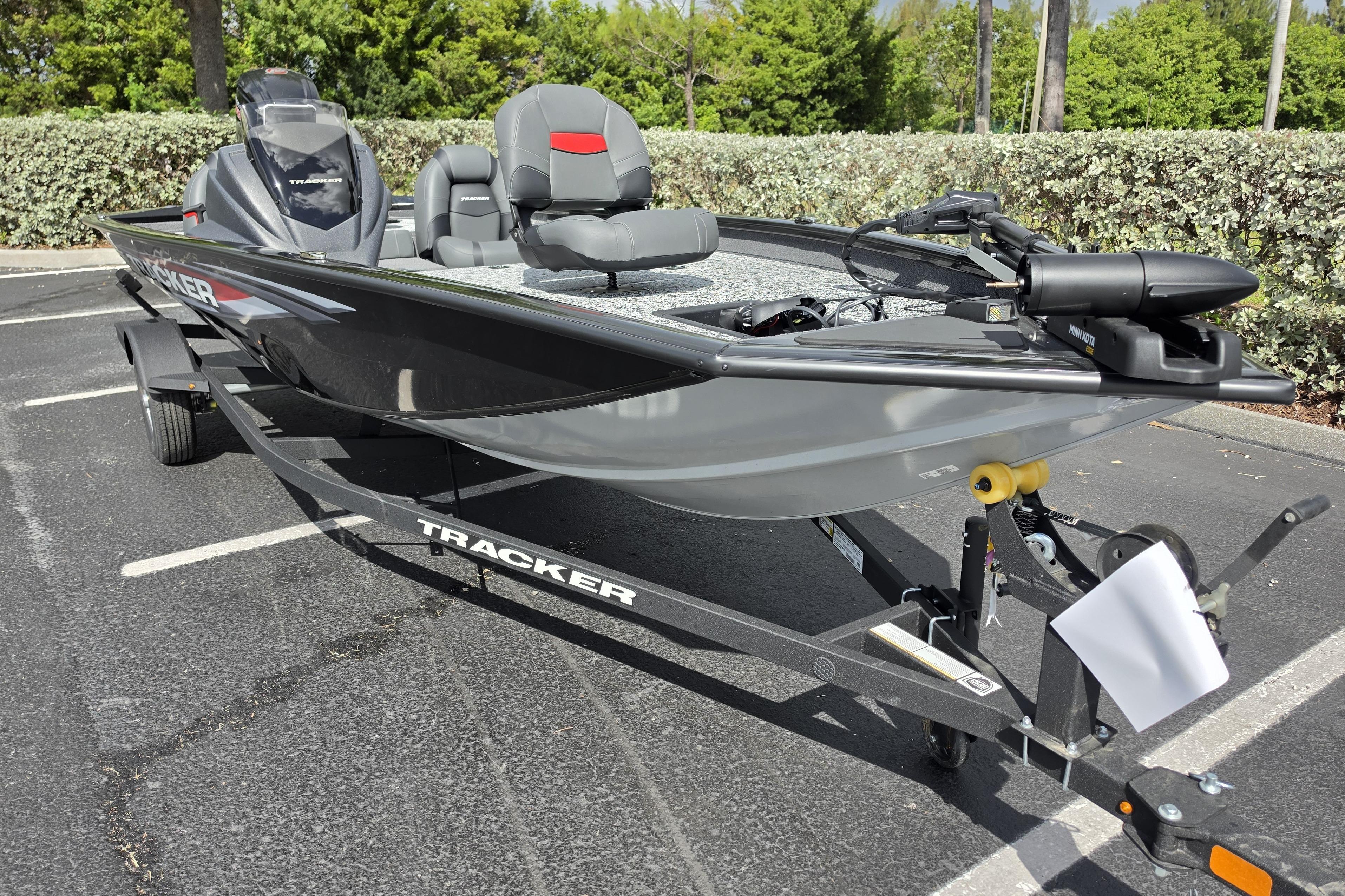 2026 Tracker Pro Team 190 boat on trailer, parked outdoors, showcasing sleek design.