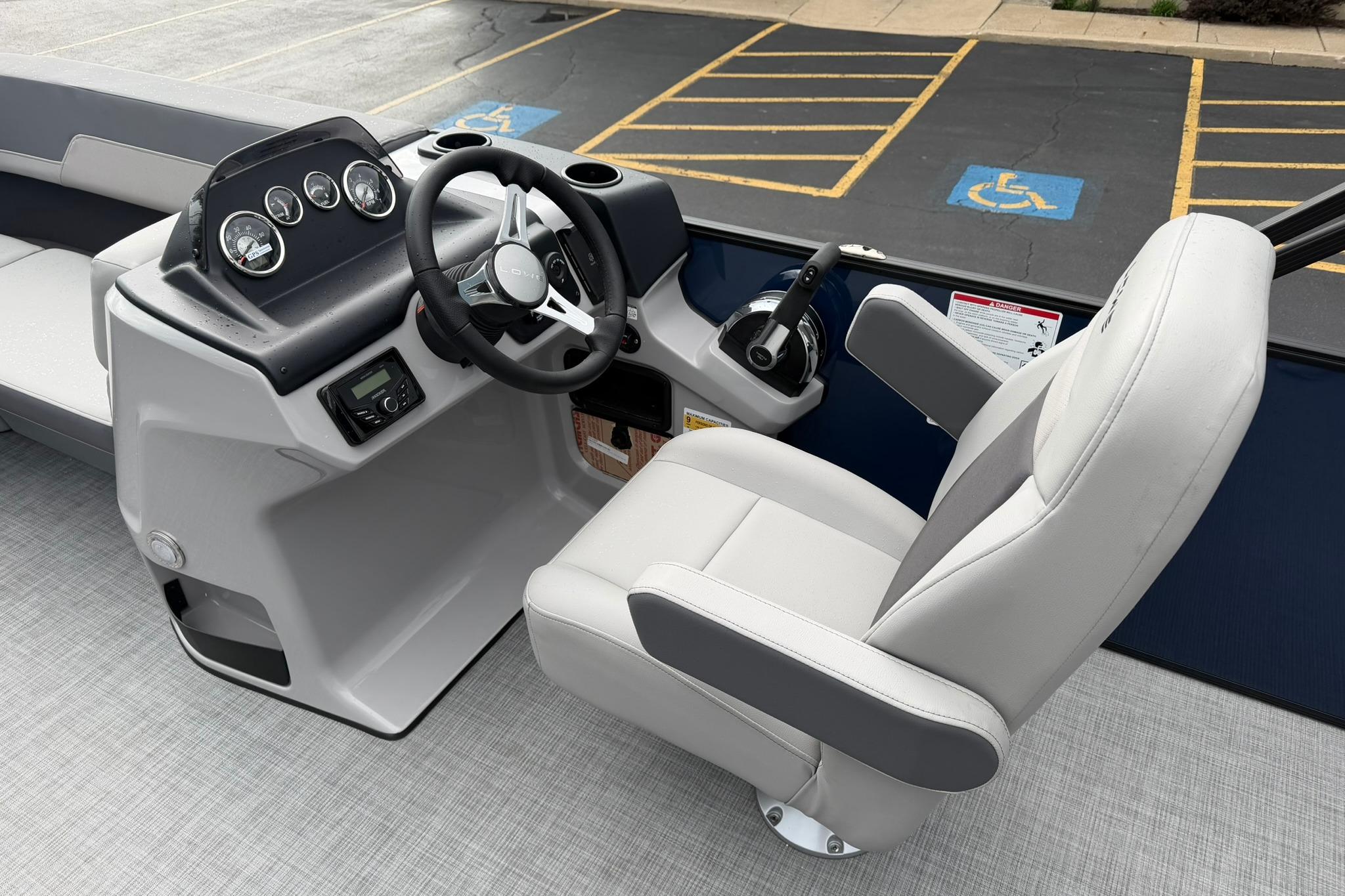 Steering console of 2026 Lowe LS 190 boat with modern controls and comfortable seating.