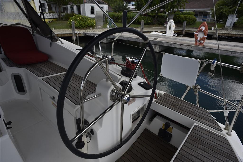 Steering wheel of 2013 Jeanneau Sun Odyssey 41 DS at dock.
