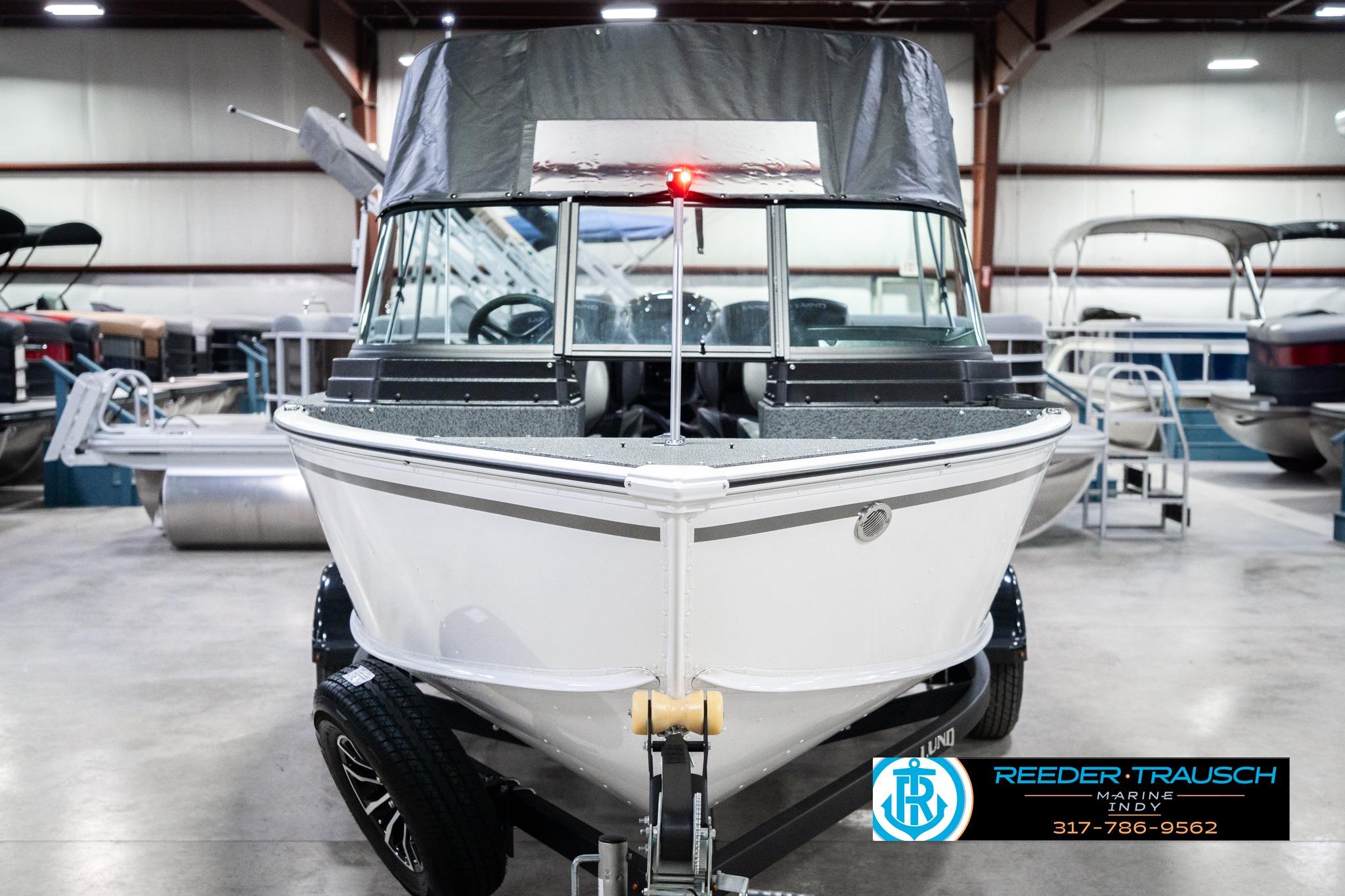 2026 Lund 1700 Explorer Sport boat in showroom, front view with canopy.