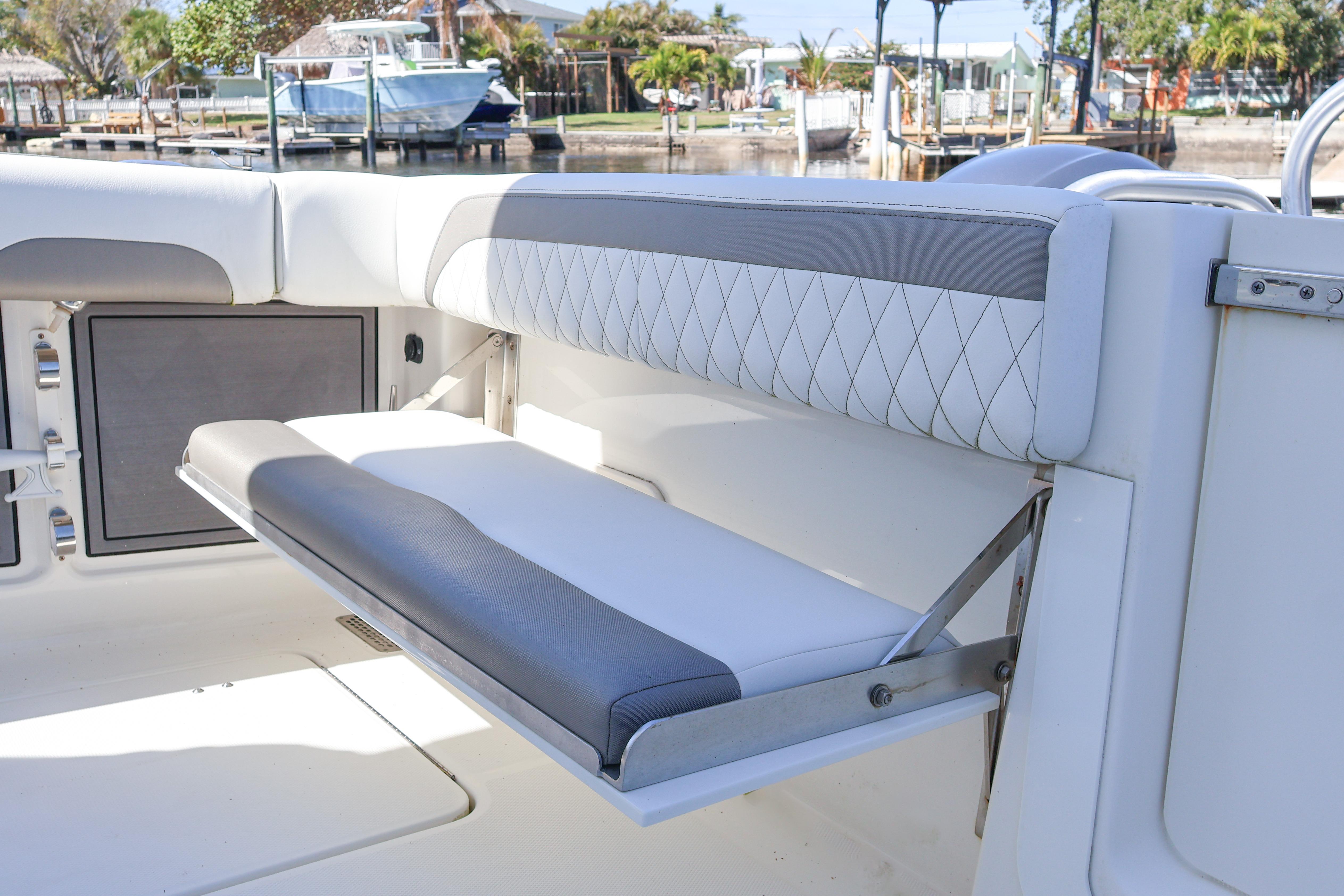 2022 World Cat 280 CC-X boat with foldable seating and sleek design.