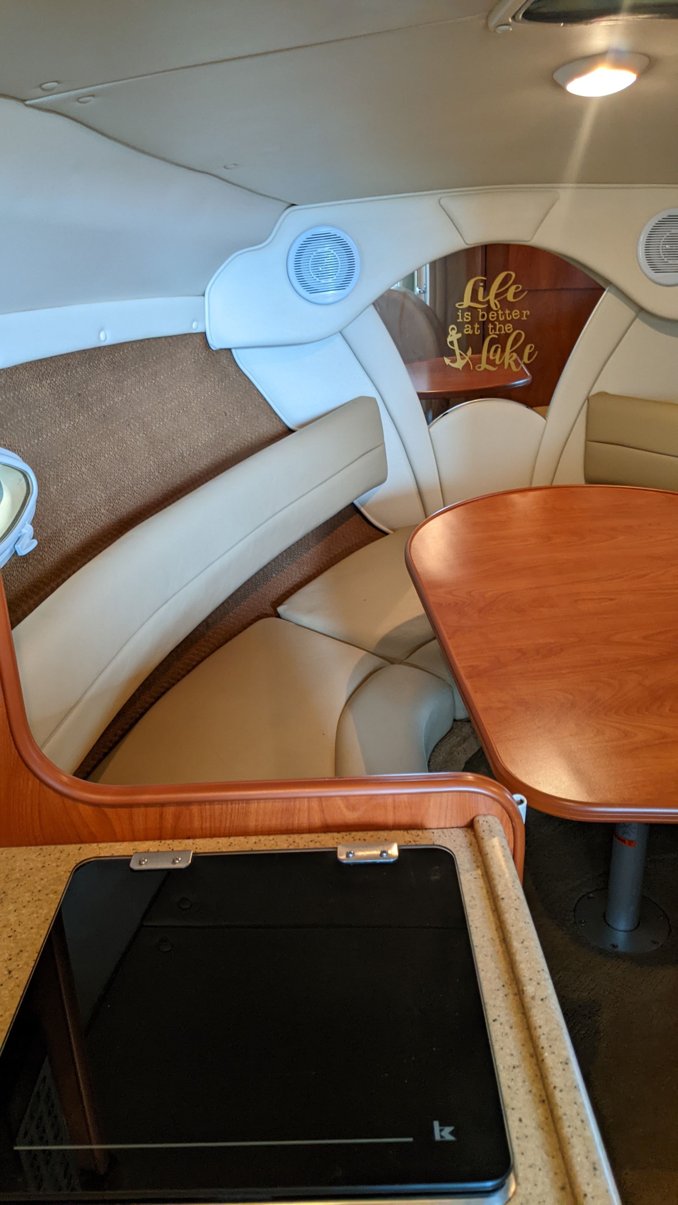 Interior of a 2006 Rinker 250 EC boat with seating area.