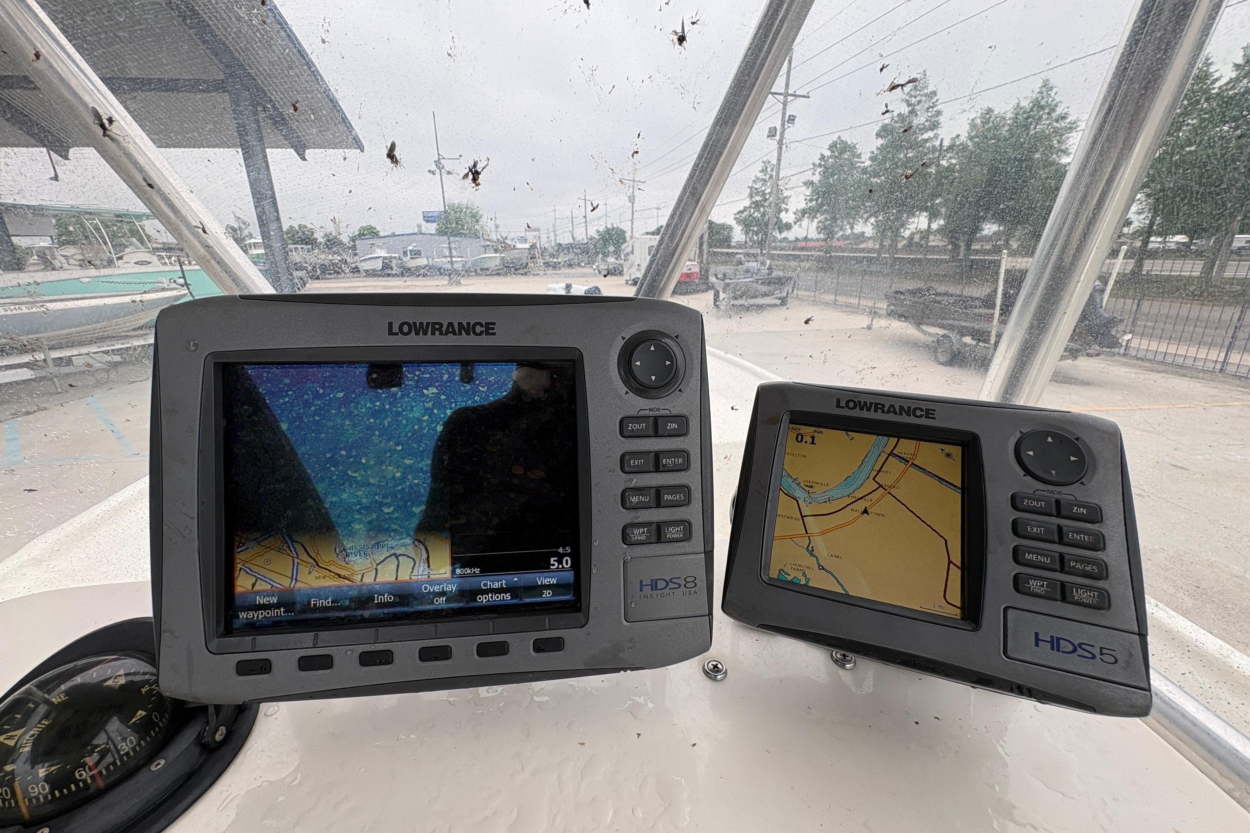 Lowrance navigation displays on a 1998 Hydra-Sports 22 Ocean CC boat dashboard.
