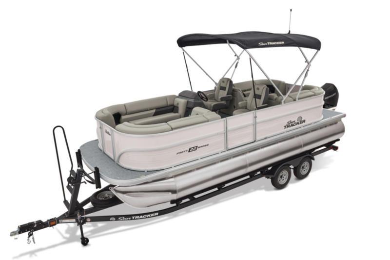 2026 Sun Tracker Party Barge 22 DLX pontoon boat on trailer, featuring spacious seating and canopy.