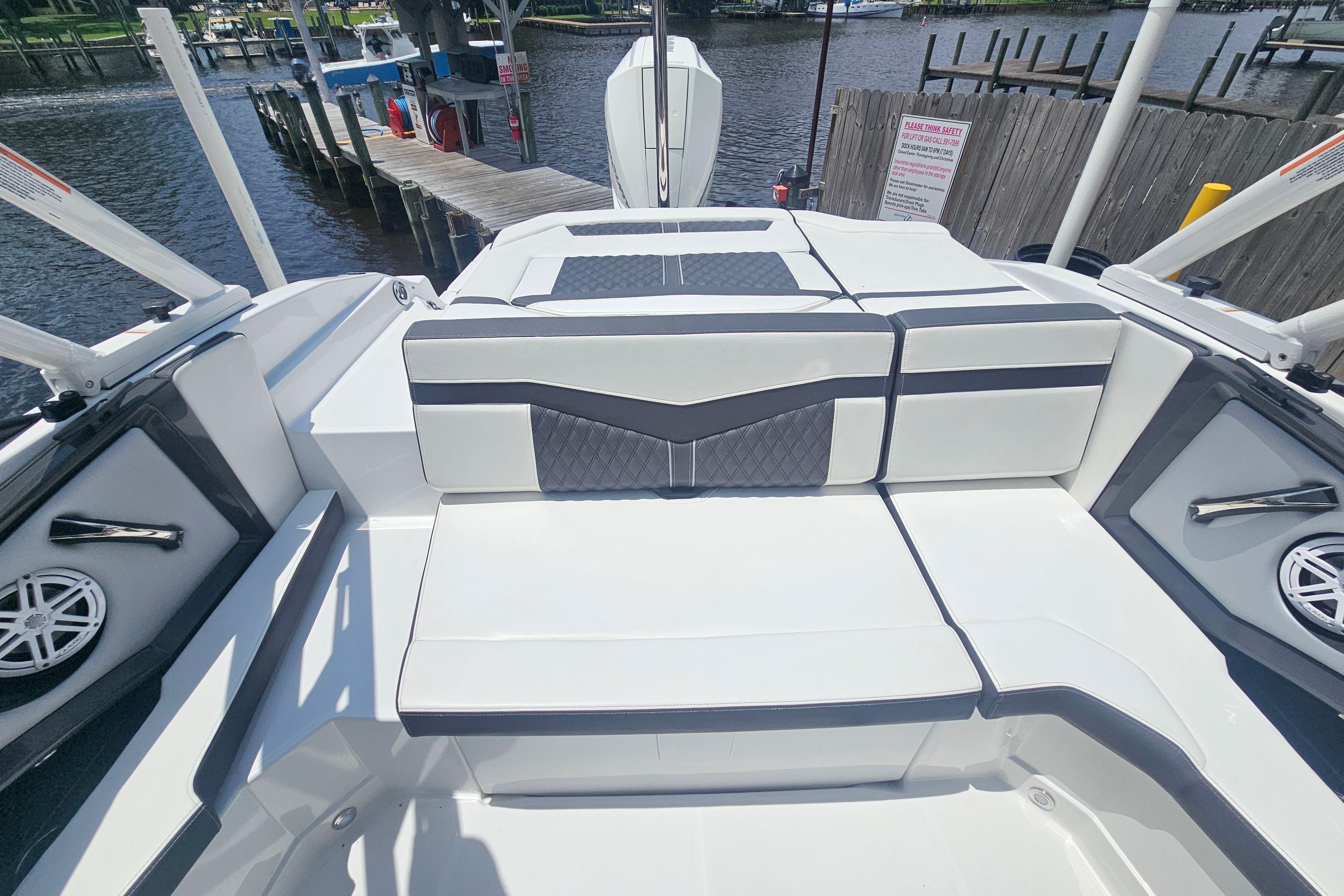 2024 Monterey 215SS Super Sport boat interior with sleek seating and waterfront view.