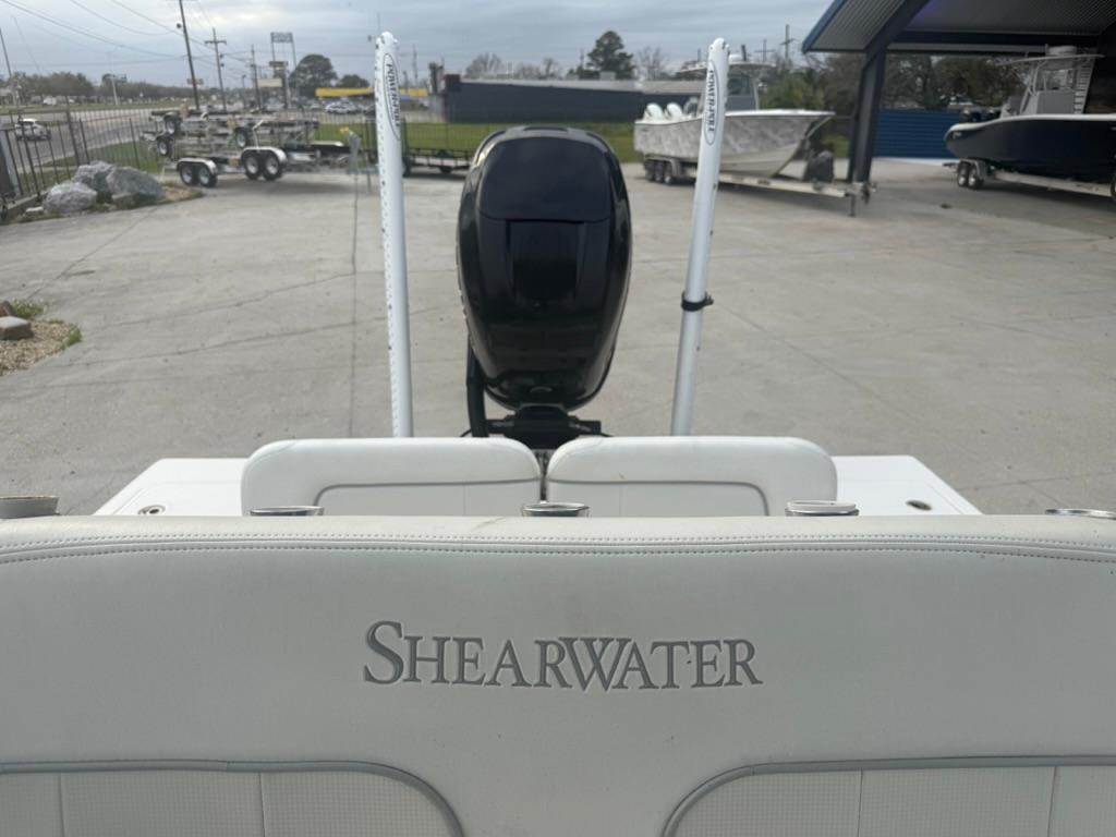 2017 ShearWater 270 Carolina Flare boat with motor, parked in a lot.